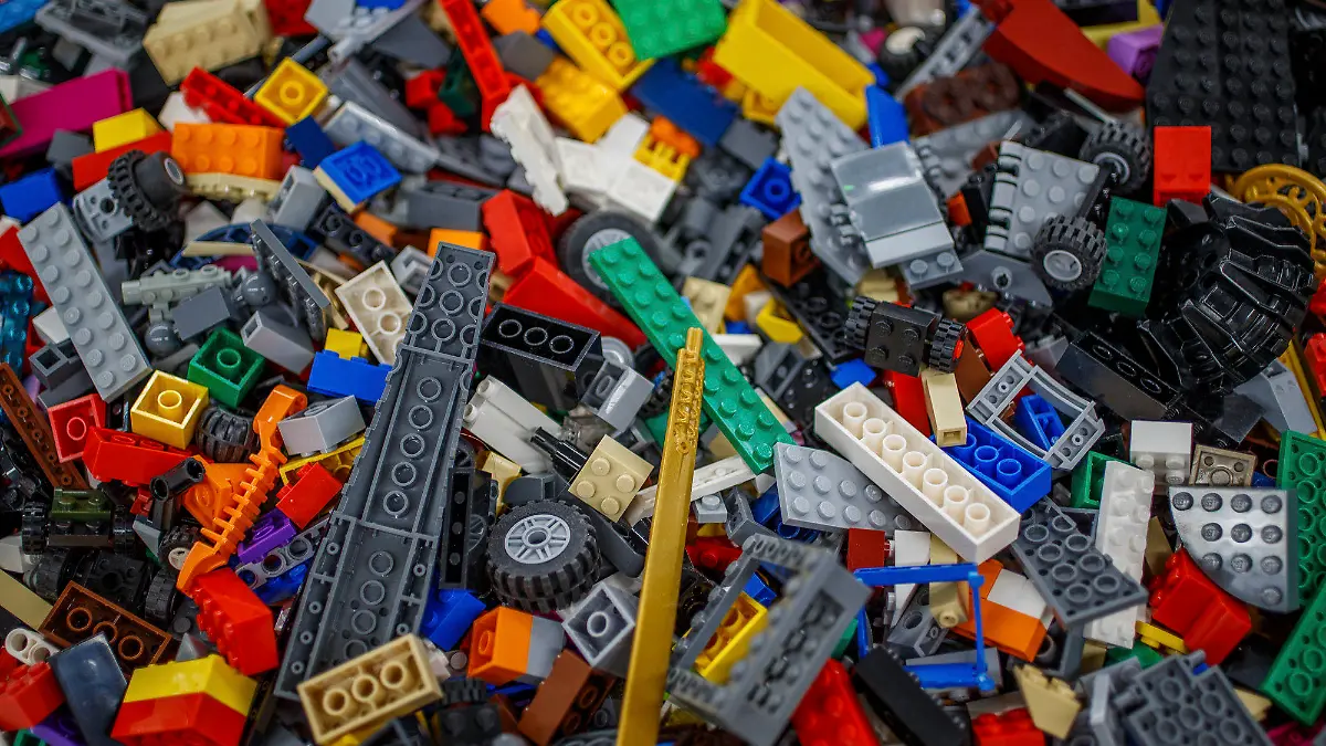 Various Lego parts, pieces and sets sit ready to sell Monday, Nov. 29, 2021, inside It's A Block Party in Indianapolis. The store is the main commercial arm of Doug Davis’ lifelong Lego collection -- some 5,000 square feet of floor-to-ceiling bricks, all of the small variety. (Mykal McEldowney /The Indianapolis Star via AP)