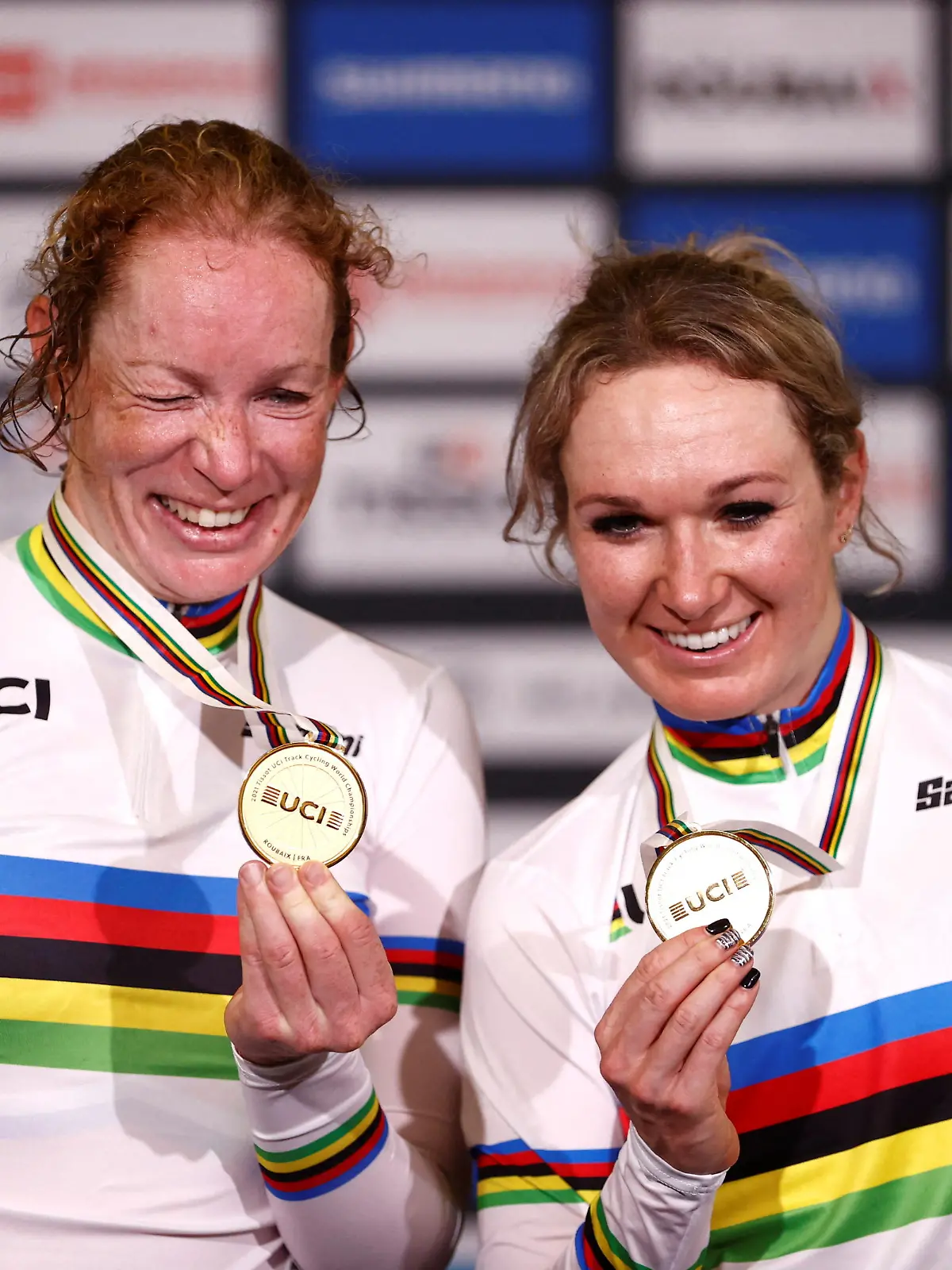 FILE PHOTO: Cycling - UCI Track Cycling World Championships - Stab Velodrome, Roubaix, France - October 23, 2021 Netherlands' Amy Pieters and Kirsten Wild celebrate with their gold medals on the podium after winning the Women's Madison final REUTERS/Christian Hartmann/File Photo