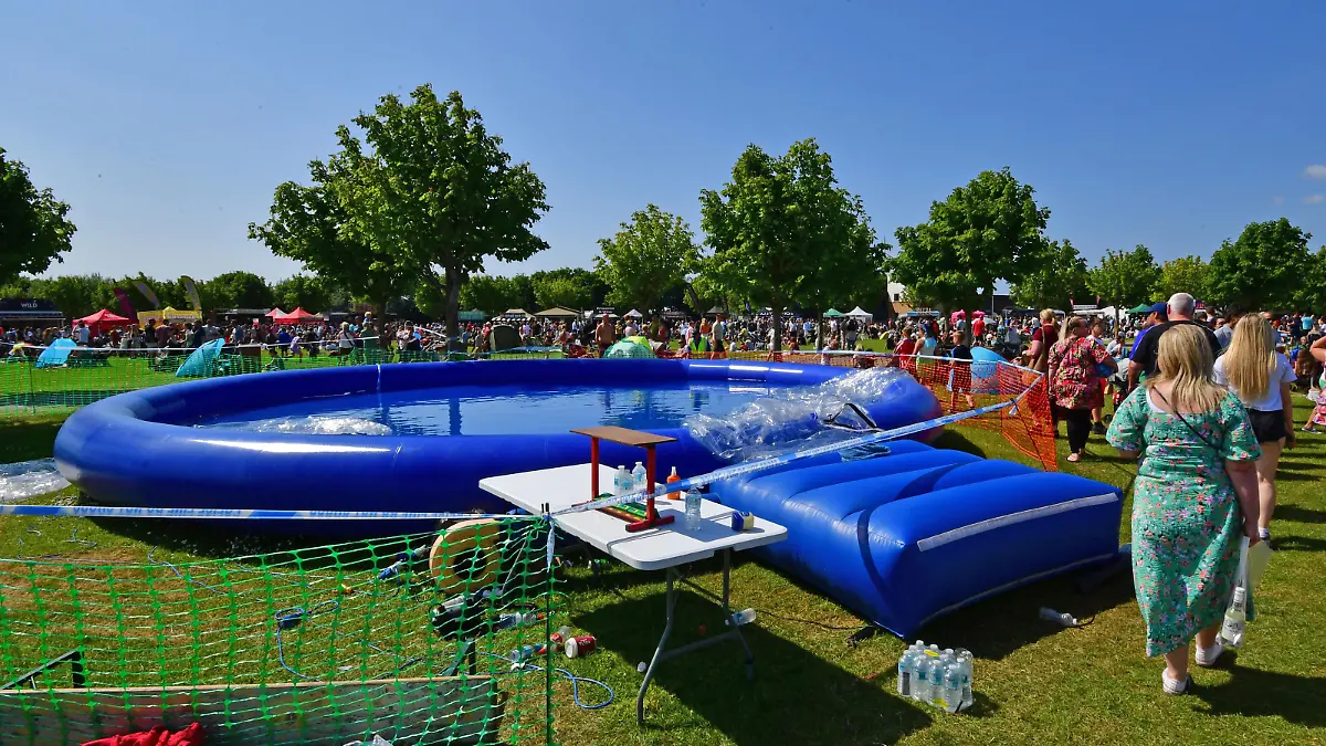 Caption: Police at the Southport Food & Drink Festival at Victoria Park, Southport, Merseyside, where a nine-year-old boy was injured on 4 June 2023 after being swept inside an inflatable ball