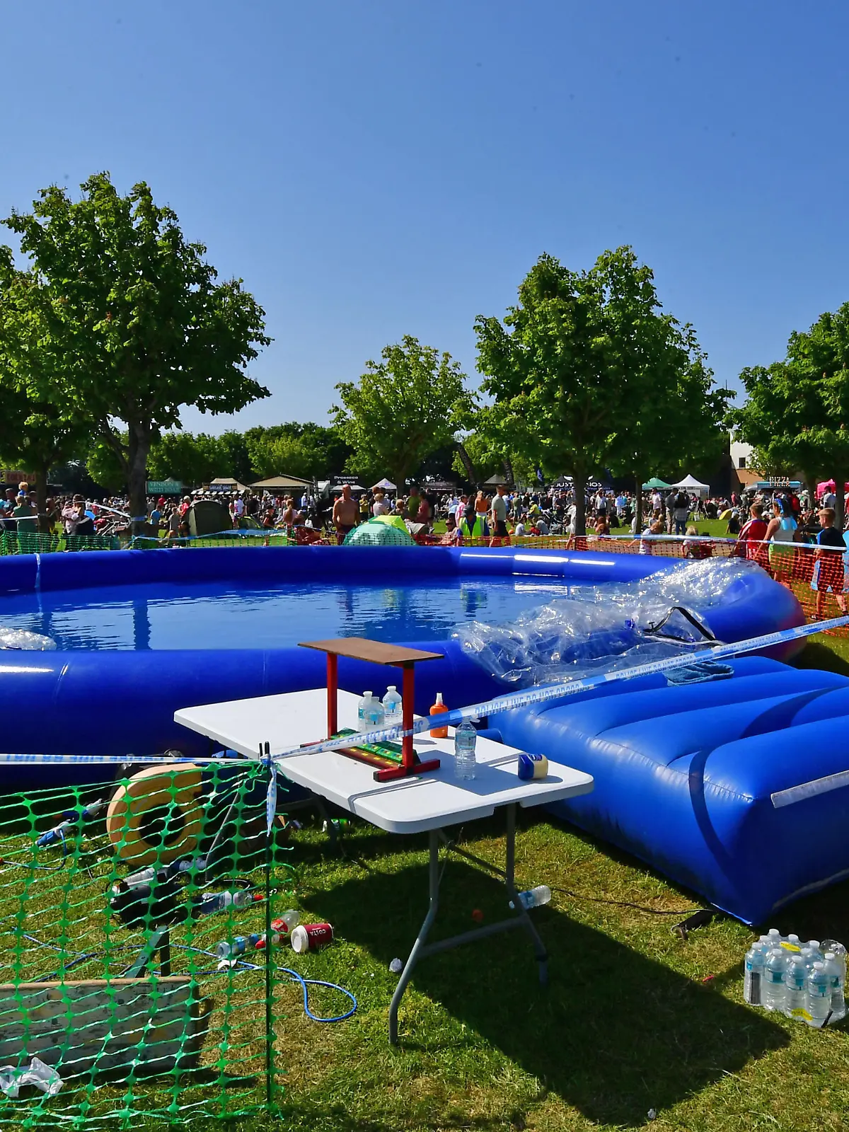 Caption: Police at the Southport Food & Drink Festival at Victoria Park, Southport, Merseyside, where a nine-year-old boy was injured on 4 June 2023 after being swept inside an inflatable ball