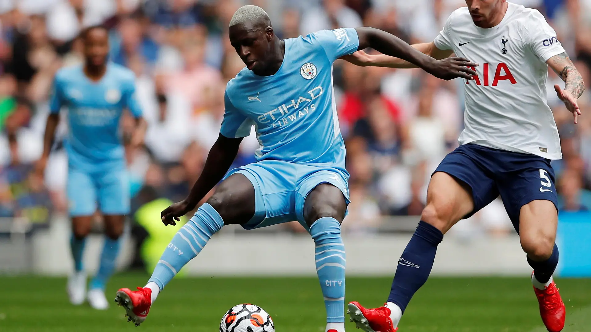 FILE PHOTO: Soccer Football - Premier League - Tottenham Hotspur v Manchester City - Tottenham Hotspur Stadium, London, Britain - August 15, 2021  Manchester City's Benjamin Mendy in action with Tottenham Hotspur's Pierre-Emile Hojbjerg Action Images via Reuters/Andrew Couldridge EDITORIAL USE ONLY. No use with unauthorized audio, video, data, fixture lists, club/league logos or 'live' services. Online in-match use limited to 75 images, no video emulation. No use in betting, games or single club /league/player publications.  Please contact your account representative for further details./File Photo