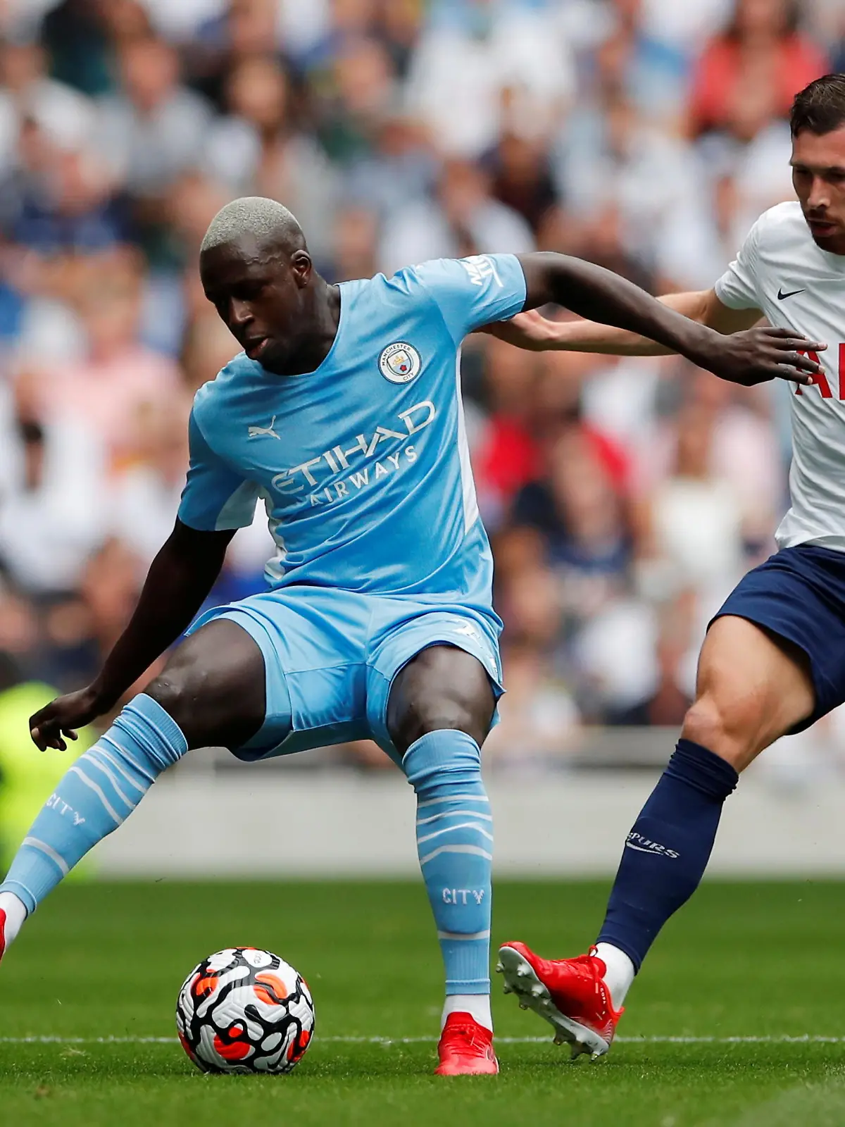 FILE PHOTO: Soccer Football - Premier League - Tottenham Hotspur v Manchester City - Tottenham Hotspur Stadium, London, Britain - August 15, 2021  Manchester City's Benjamin Mendy in action with Tottenham Hotspur's Pierre-Emile Hojbjerg Action Images via Reuters/Andrew Couldridge EDITORIAL USE ONLY. No use with unauthorized audio, video, data, fixture lists, club/league logos or 'live' services. Online in-match use limited to 75 images, no video emulation. No use in betting, games or single club /league/player publications.  Please contact your account representative for further details./File Photo