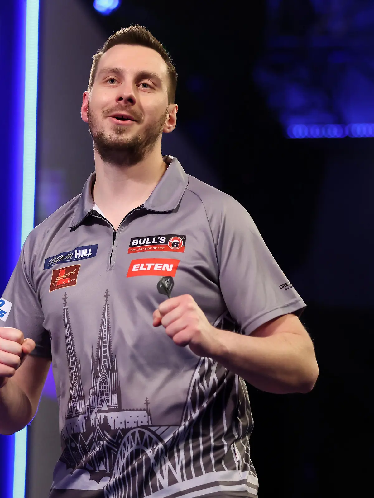 LONDON, ENGLAND - DECEMBER 21: Florian Hempel of Germany in action during his Second Round Match against Dimitri Van den Bergh of Belgium during Day Seven of The  William Hill World Darts Championship at Alexandra Palace on December 21, 2021 in London, England. (Photo by Luke Walker/Getty Images)