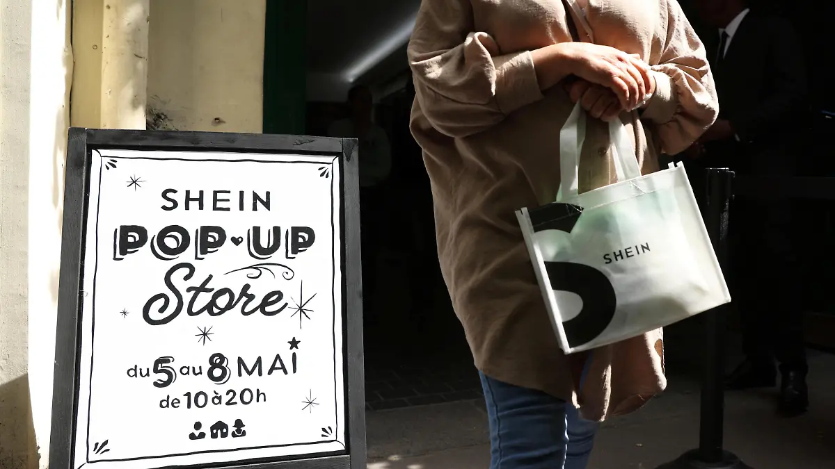 A woman leaves a pop-up store of Chinese fast-fashion retailer Shein in Paris, France, May 5, 2023. REUTERS/Johanna Geron