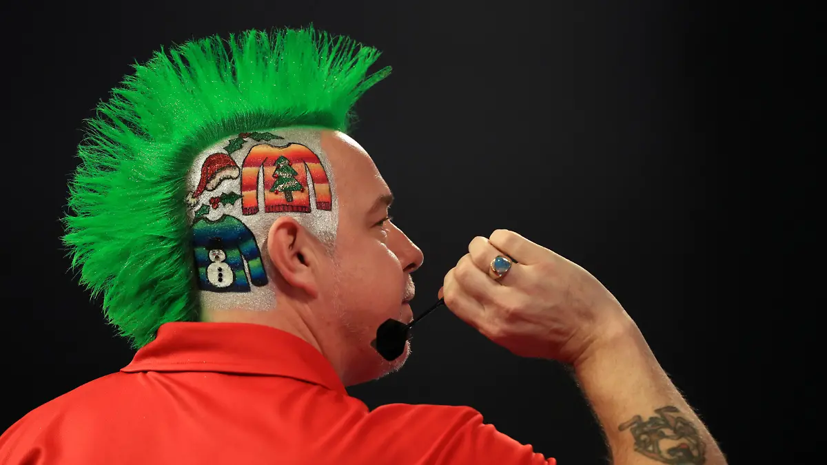 William Hill World Darts Championship - Day Two - Alexandra Palace. Peter Wright with Christmas jumpers painted onto the side of his head on Christmas Jumper Day during day two of the William Hill World Darts Championship at Alexandra Palace, London. Picture date: Friday December 16, 2016. See PA story DARTS World. Photo credit should read: John Walton/PA Wire. RESTRICTIONS: Use subject to restrictions. Editorial use only. No commercial use. Call +44 (0)1158 447447 for further information. URN:29493469