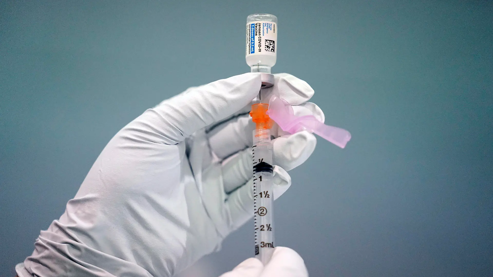 FILE - A member of the Philadelphia Fire Department prepares a dose of the Johnson & Johnson COVID-19 vaccine at a vaccination site setup in Philadelphia, on March 26, 2021. A government advisory panel is meeting Thursday, Dec. 16, to determine if any restrictions are needed to the Johnson & Johnson COVID-19 vaccine because of rare but serious blood clots. (AP Photo/Matt Rourke, File)
