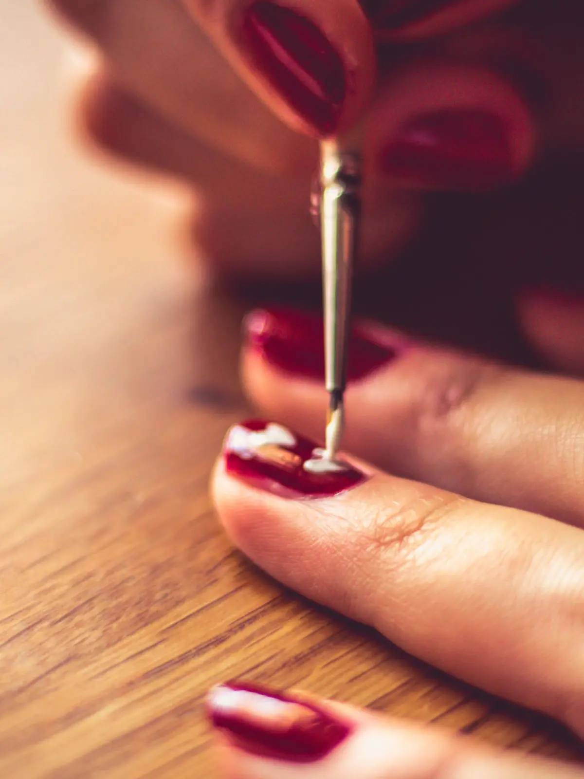Woman getting manicure.