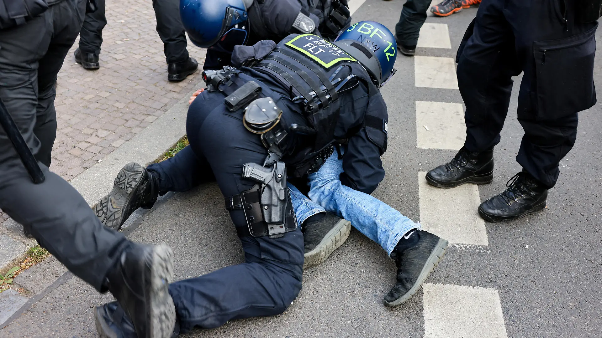 Police officers detain a demonstrator as left-wing protesters gather after a court in Dresden ruled five years of prison in the case against 28-year-old student Lina E., accused of "serious acts of violence" against right-wing extremists, in Leipzig, Germany, June 3, 2023. REUTERS/Christian Mang