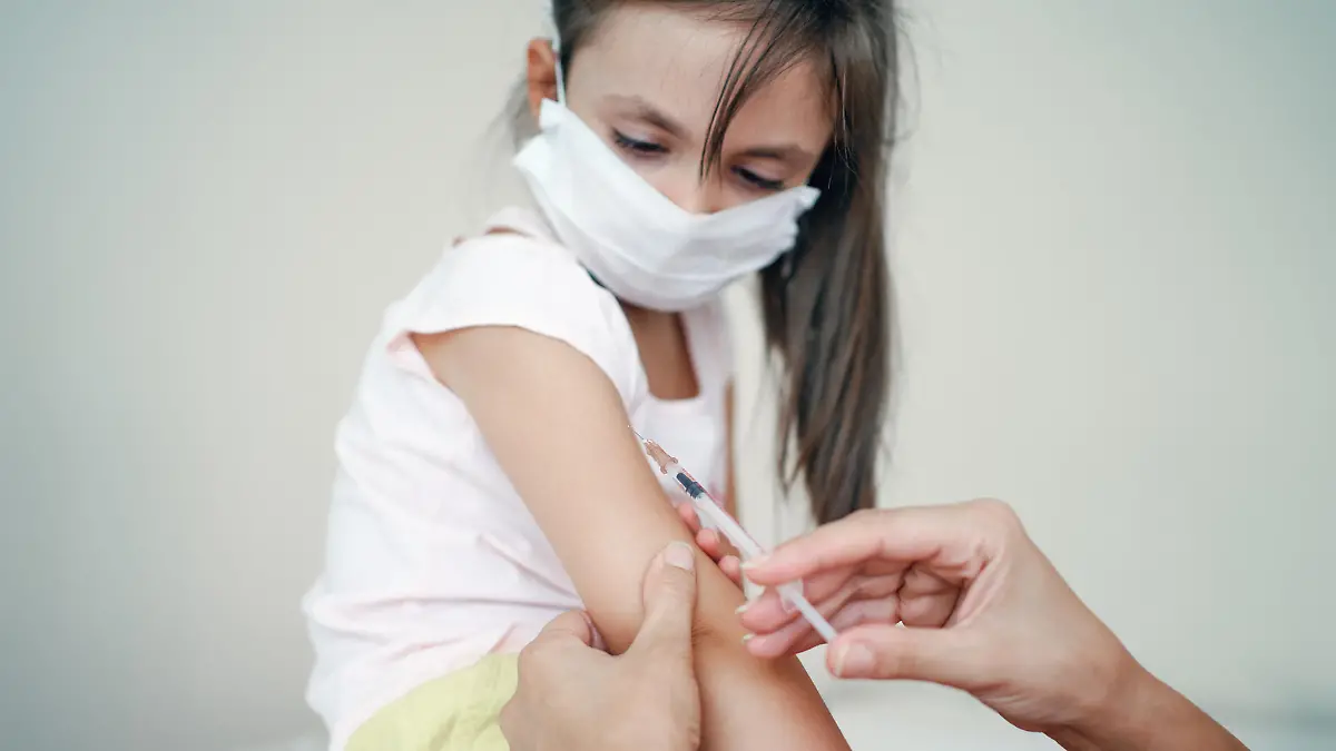 Pediatrician makes vaccination to cute girl