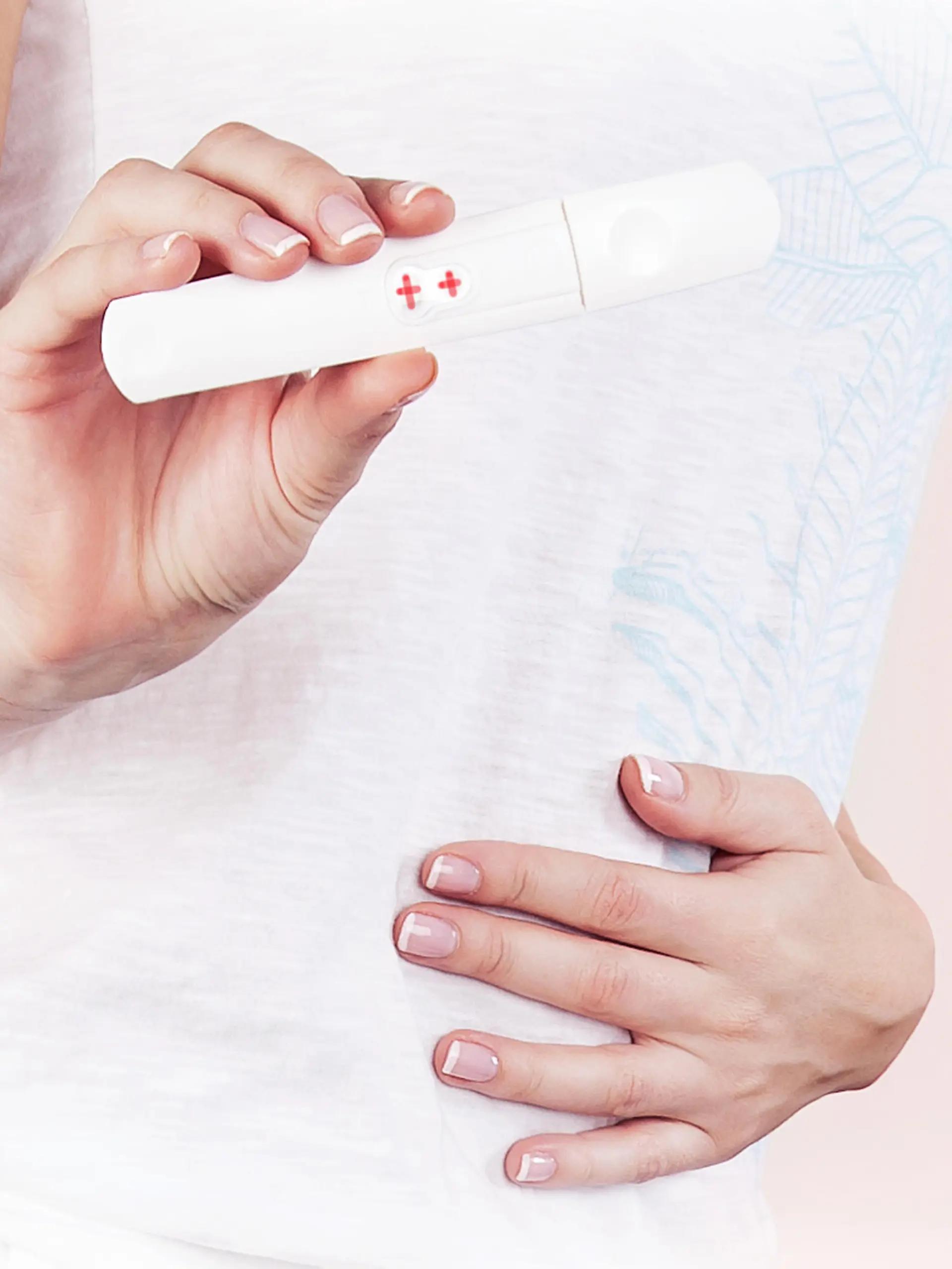 Positive pregnancy test result, closeup on pregnant belly, healthy mother touching tummy, female hand hold medical hormone test, isolated, new life and new family concept