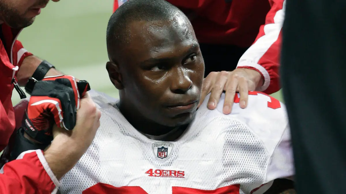 FILE - In this Dec. 26, 2010, file photo, San Francisco 49ers cornerback Phillip Adams (35) is attended to after injuring his left leg during the third quarter of an NFL football game against the St. Louis Rams, in St. Louis. On Tuesday, Dec. 14, 2021, a coroner is set to release the results of a brain test for chronic traumatic encephalopathy on former NFL player Adams, who was accused of fatally shooting six people in Rock Hill, South Carolina, before killing himself in April. Adams' family agreed after his death to have his brain tested for the degenerative disease linked to head trauma and concussions. (AP Photo/Tom Gannam, File)