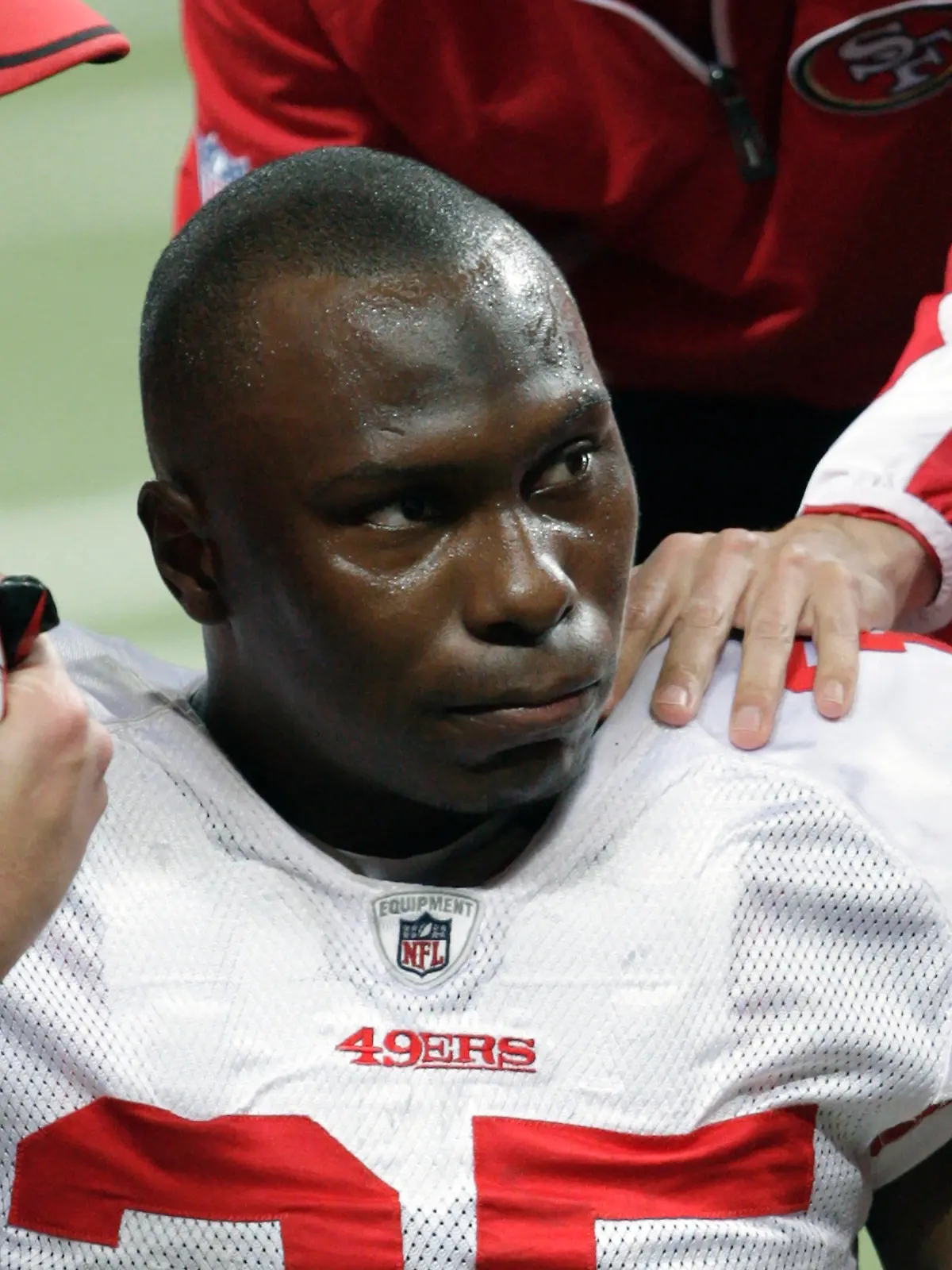 FILE - In this Dec. 26, 2010, file photo, San Francisco 49ers cornerback Phillip Adams (35) is attended to after injuring his left leg during the third quarter of an NFL football game against the St. Louis Rams, in St. Louis. On Tuesday, Dec. 14, 2021, a coroner is set to release the results of a brain test for chronic traumatic encephalopathy on former NFL player Adams, who was accused of fatally shooting six people in Rock Hill, South Carolina, before killing himself in April. Adams' family agreed after his death to have his brain tested for the degenerative disease linked to head trauma and concussions. (AP Photo/Tom Gannam, File)