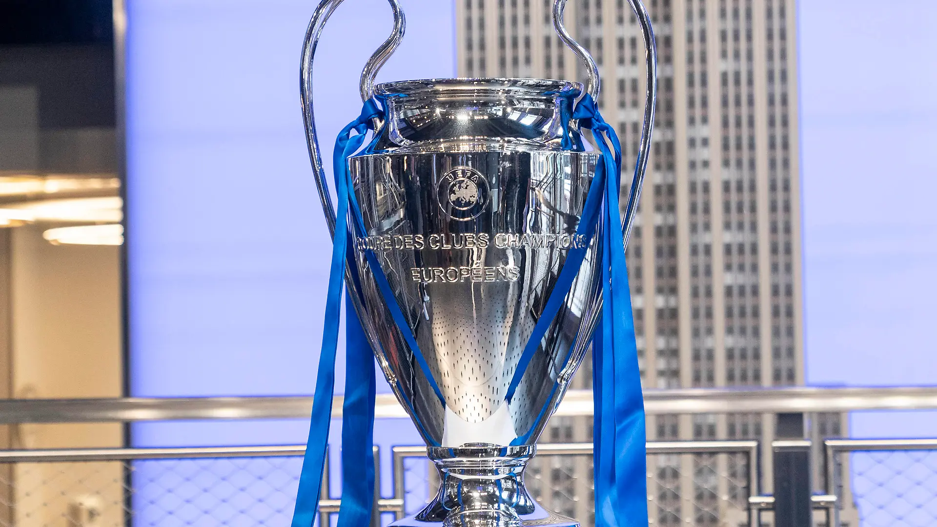 Chelsea FC legend Ashley Cole with Champions League Trophy at Empire State Building Champions League Trophy on display at Grand Staircase of the Empire State Building New York New York United States Copyright: LevxRadin
