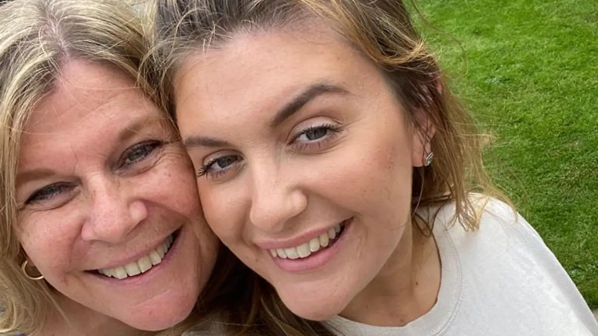 CATERS NEWS (PICTURED Chloe posing with her Mother) A key worker who was told she had covid due to her five-month-long cough has now been told she actually has cancer. Chloe Girardier, 23, from Harrogate, North Yorkshire, believed she had contracted a cold in July after experiencing a chesty cough but was left concerned after the cough continued weeks after. Chloe, who claimed to initially be denied an in-person doctor's appointment, was given antibiotics, inhalers, and acid reflux tablets to no avail. But after seven doctor's appointments, Chloe had had enough after noticing she was losing weight and demanded a chest X-ray to discover what was causing her continuous cough. SEE CATERS COPY