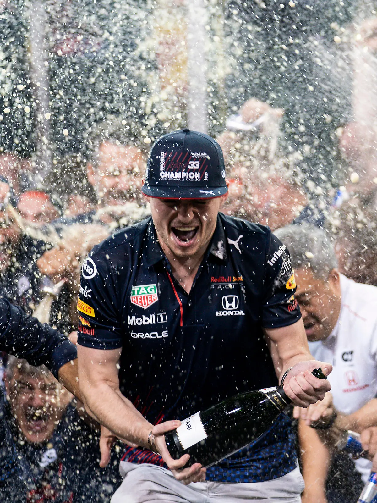  December 12, 2021, Abu Dhabi, United Arab Emirates: MAX VERSTAPPEN of the Netherlands and Red Bull Racing celebrates with his team after winning the 2021 FIA Formula 1 Abu Dhabi Grand Prix and the Formula 1 World Championship, WM, Weltmeisterschaft at Yas Marina Circuit in Abu Dhabi, United Arab Emirates. Abu Dhabi United Arab Emirates - ZUMAg147 20211212_zap_g147_109 Copyright: xJamesxGasperottix