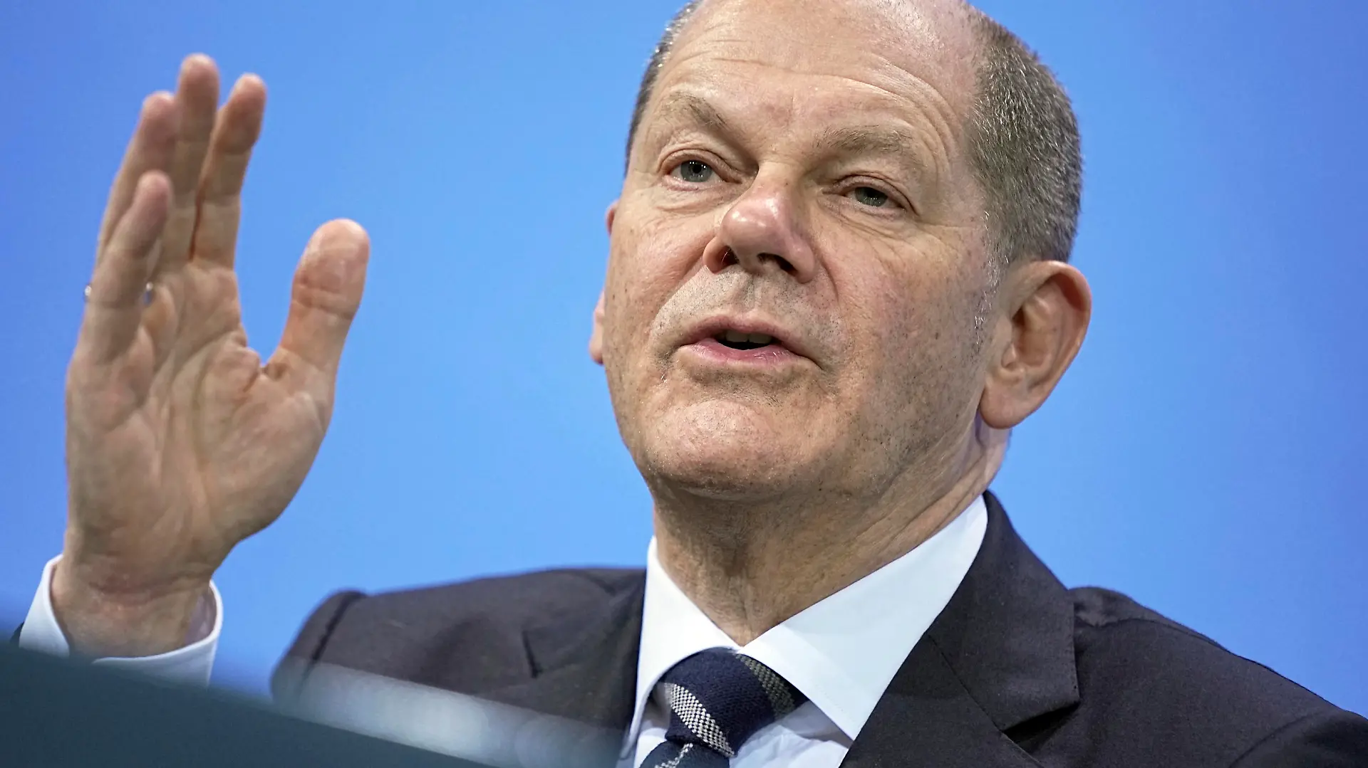 German Chancellor Olaf Scholz speaks at a press conference after the federal government's consultations with the state premiers in Berlin, Germany, Thursday Dec. 9, 2021. (Michael Kappeler/Pool via AP)