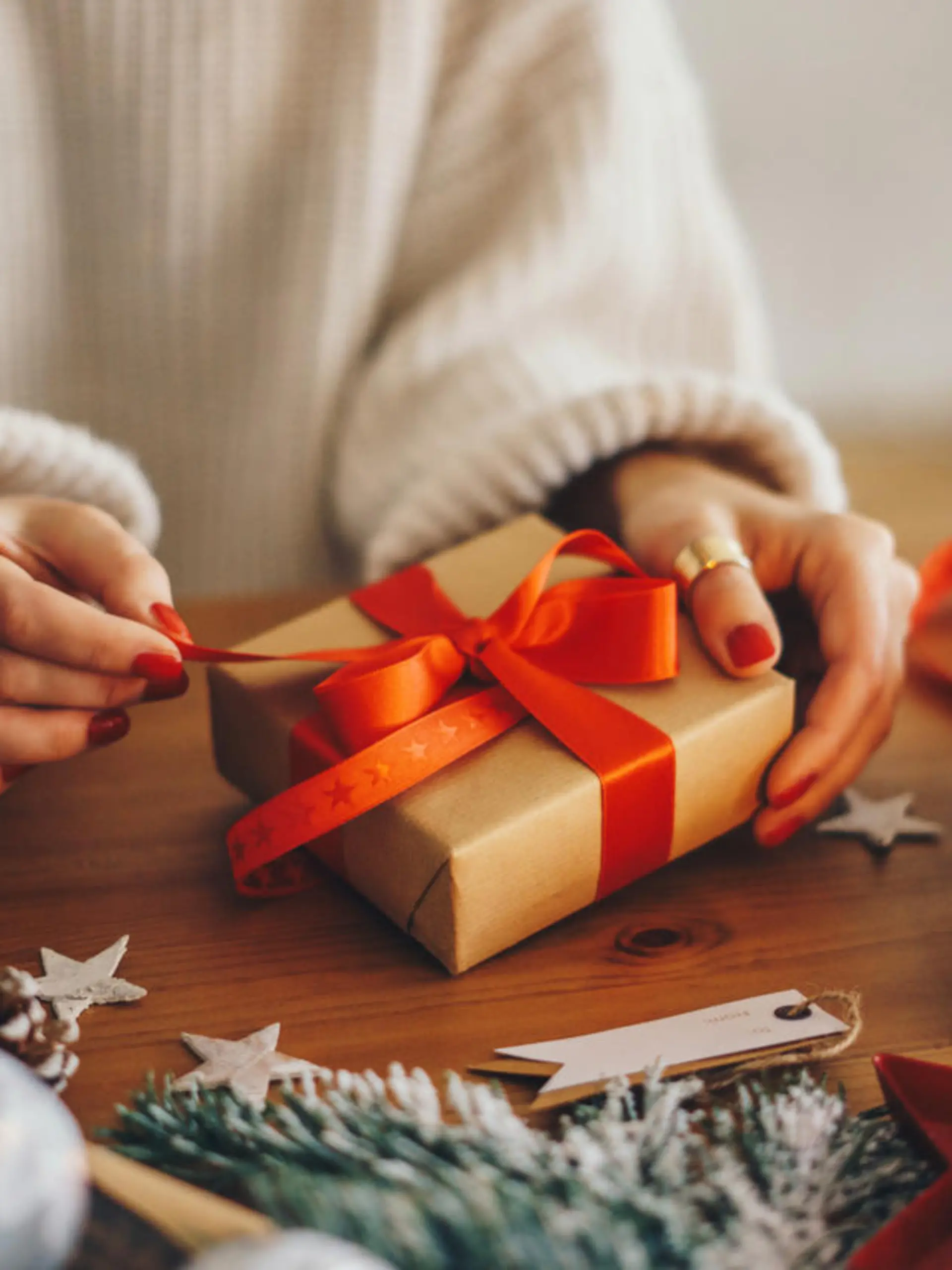 Woman wrapping Christmas gifts