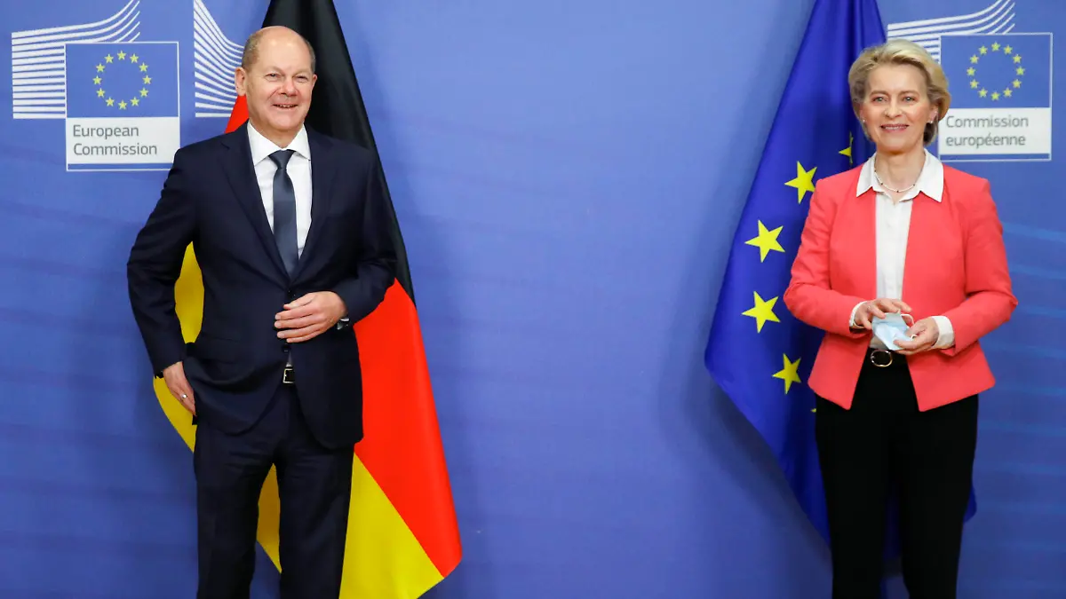German Chancellor Olaf Scholz is welcomed by President of the European Commission Ursula von der Leyen in Brussels, Belgium, Friday, Dec. 10, 2021. (Johanna Geron/Pool Photo via AP)