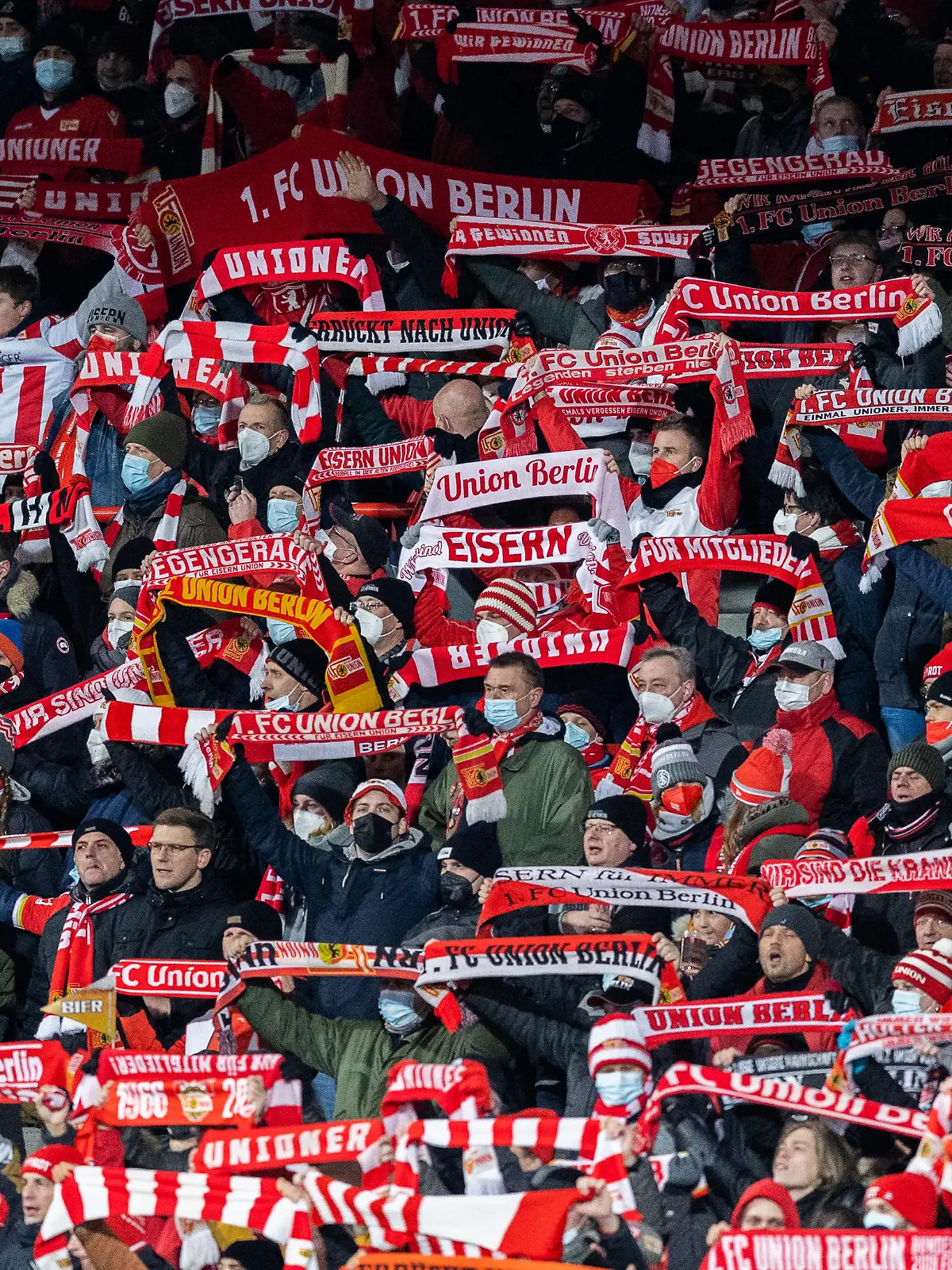 BERLIN, GERMANY - DECEMBER 03: Fans of Union Berlin celebrate during the Bundesliga match between 1. FC Union Berlin and RB Leipzig at Stadion An der Alten Foersterei on December 03, 2021 in Berlin, Germany. (Photo by Boris Streubel/Getty Images)