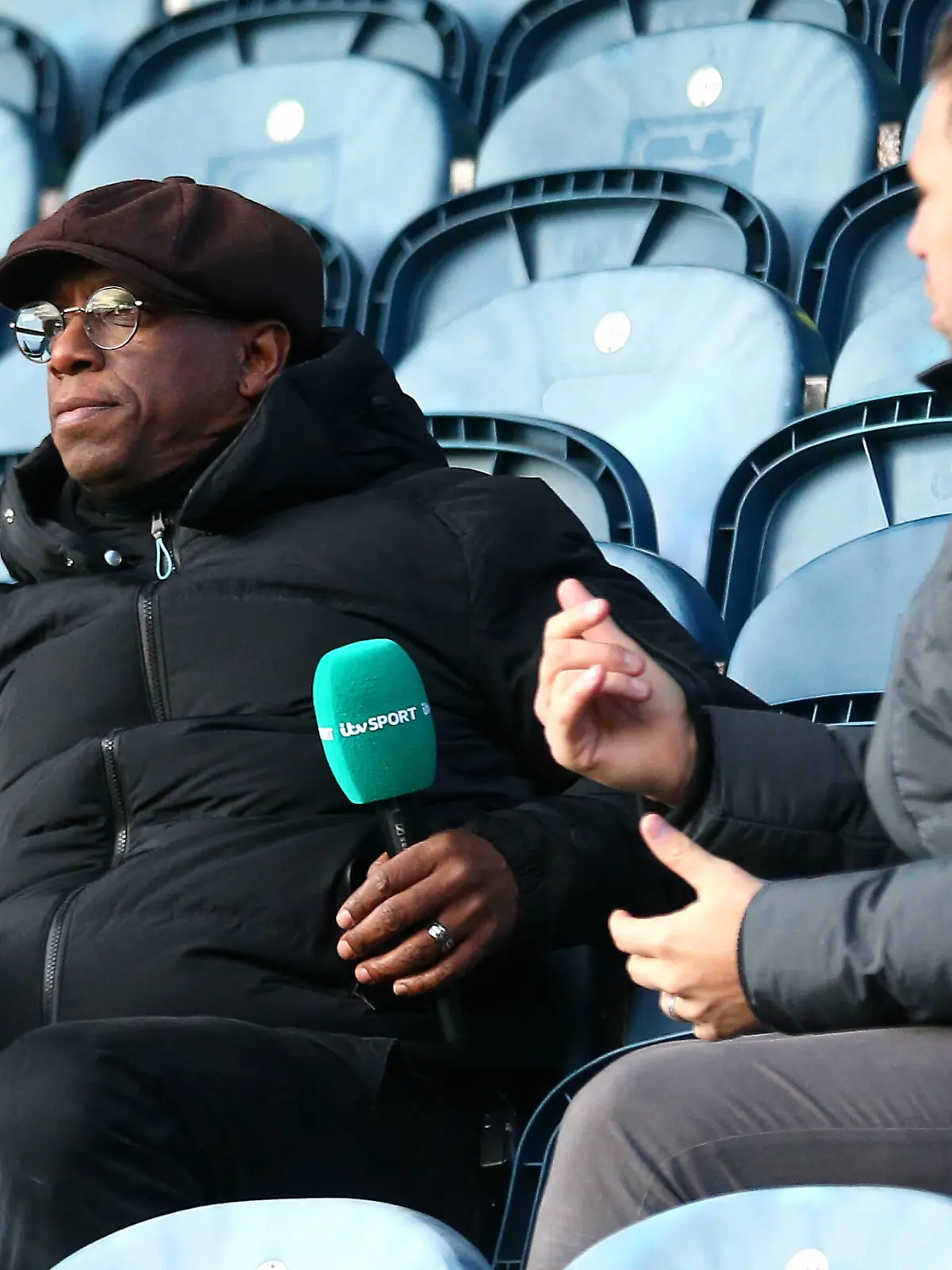 Rochdale v Plymouth Argyle - Emirates FA Cup - Second Round - Crown Oil Arena Former Arsenal player Ian Wright working for ITV in the stands during the Emirates FA Cup second round match at Crown Oil Arena, Rochdale. Picture date: Sunday December 5, 2021. EDITORIAL USE ONLY No use with unauthorised audio, video, data, fixture lists, club/league logos or live services. Online in-match use limited to 120 images, no video emulation. No use in betting, games or single club/league/player publications. PUBLICATIONxINxGERxSUIxAUTxONLY Copyright: xTimxMarklandx 64146081 