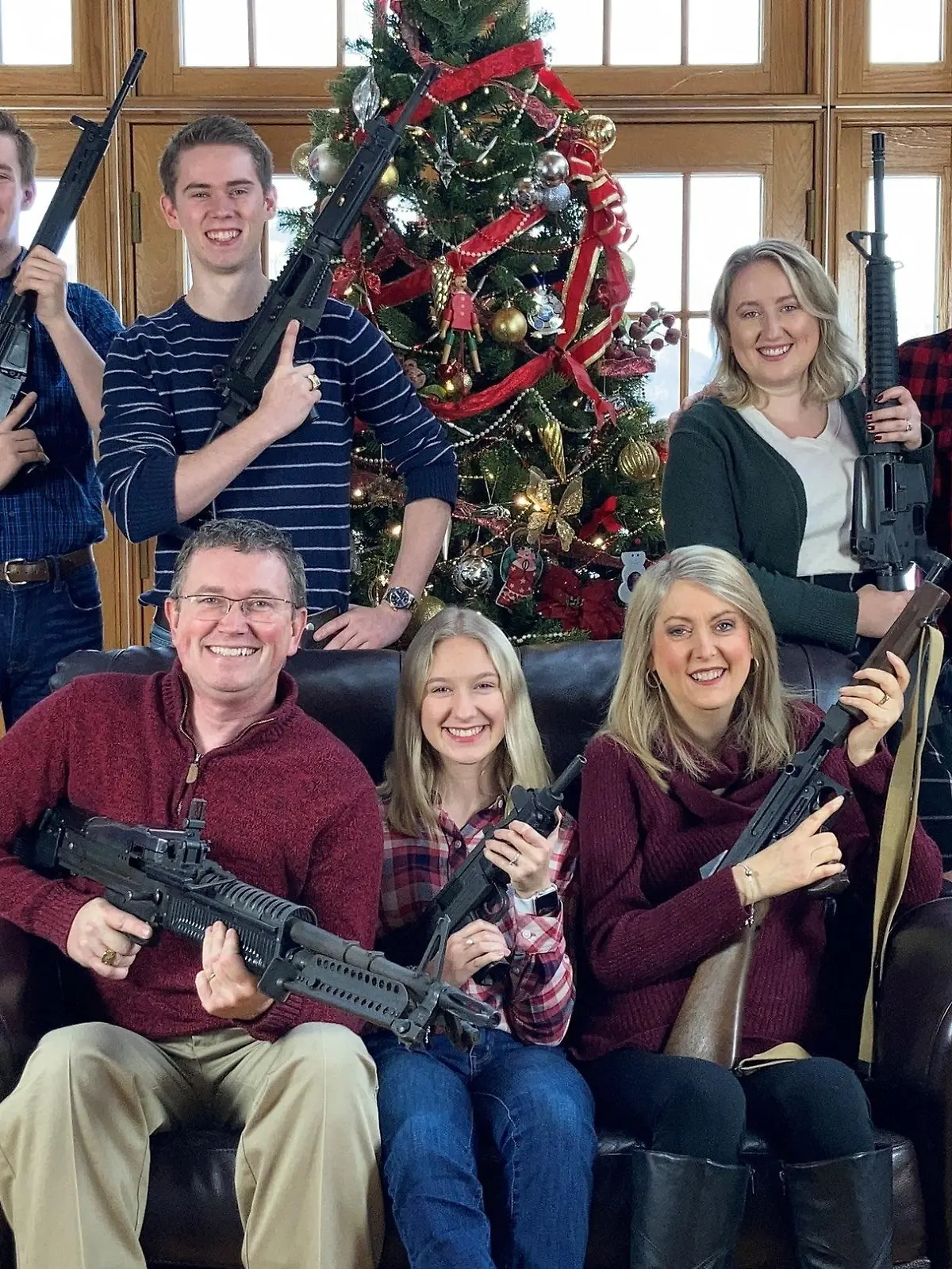 U.S. Rep. Thomas Massie (R-KY) in a Christmas photo of his family holding guns, in this image obtained from Twitter, posted on December 4, 2021. Courtesy of Twitter @REPTHOMASMASSIE / Social Media via REUTERS  ATTENTION EDITORS - THIS IMAGE HAS BEEN SUPPLIED BY A THIRD PARTY. NO RESALES. NO ARCHIVE. MANDATORY CREDIT TWITTER @REPTHOMASMASSIE.