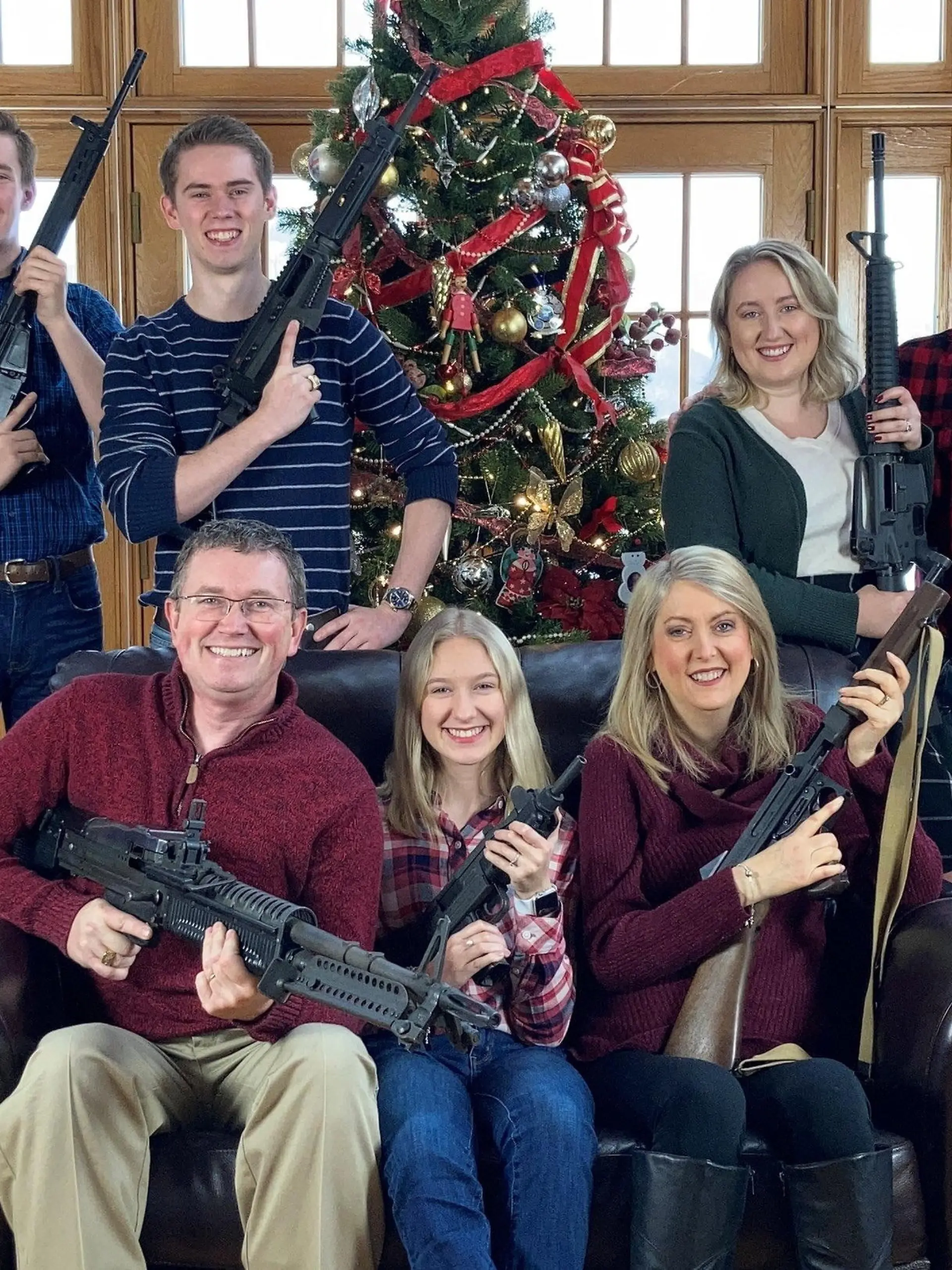 U.S. Rep. Thomas Massie (R-KY) in a Christmas photo of his family holding guns, in this image obtained from Twitter, posted on December 4, 2021. Courtesy of Twitter @REPTHOMASMASSIE / Social Media via REUTERS  ATTENTION EDITORS - THIS IMAGE HAS BEEN SUPPLIED BY A THIRD PARTY. NO RESALES. NO ARCHIVE. MANDATORY CREDIT TWITTER @REPTHOMASMASSIE.
