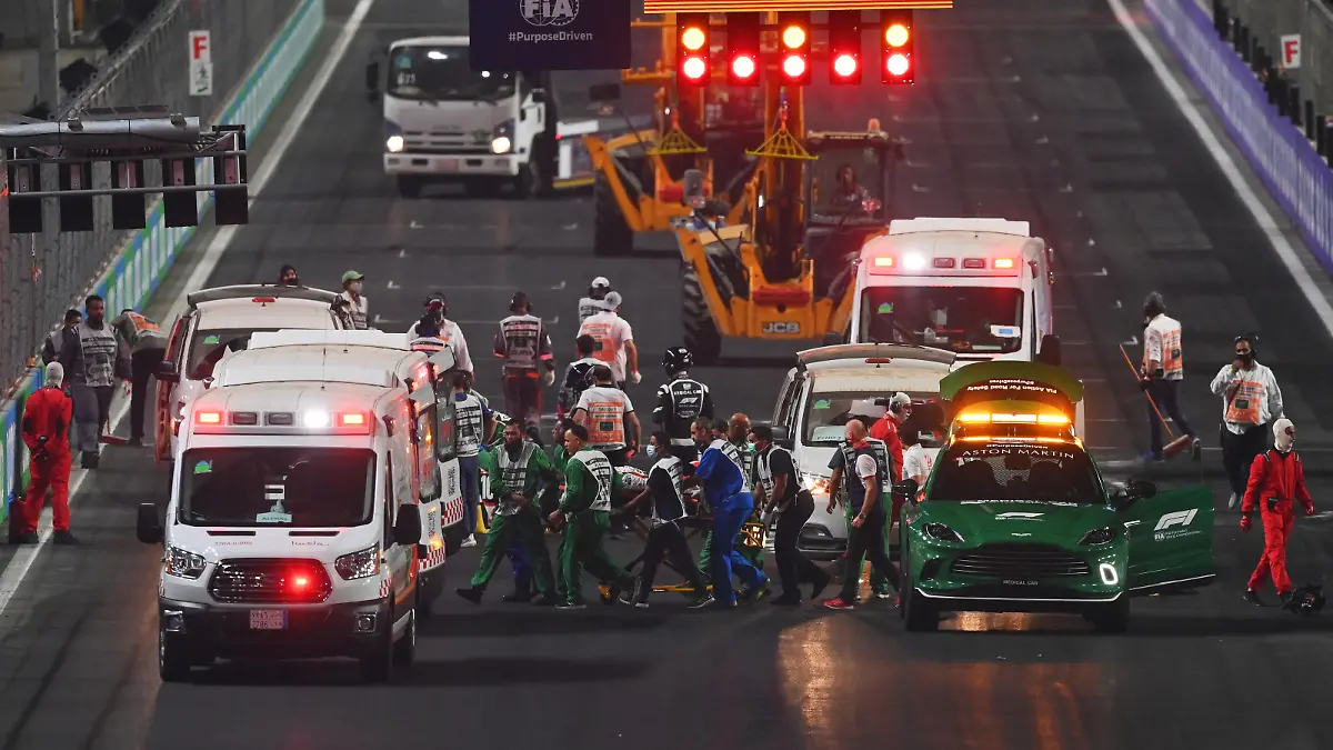 JEDDAH, SAUDI ARABIA - DECEMBER 05: Theo Pourchaire of France and ART Grand Prix and Enzo Fittipaldi of Brazil and Charouz Racing System receive medical treatment after a crash at the start during the feature race of Round 7:Jeddah of the Formula 2 Championship at Jeddah Corniche Circuit on December 05, 2021 in Jeddah, Saudi Arabia. (Photo by Dan Mullan/Getty Images)