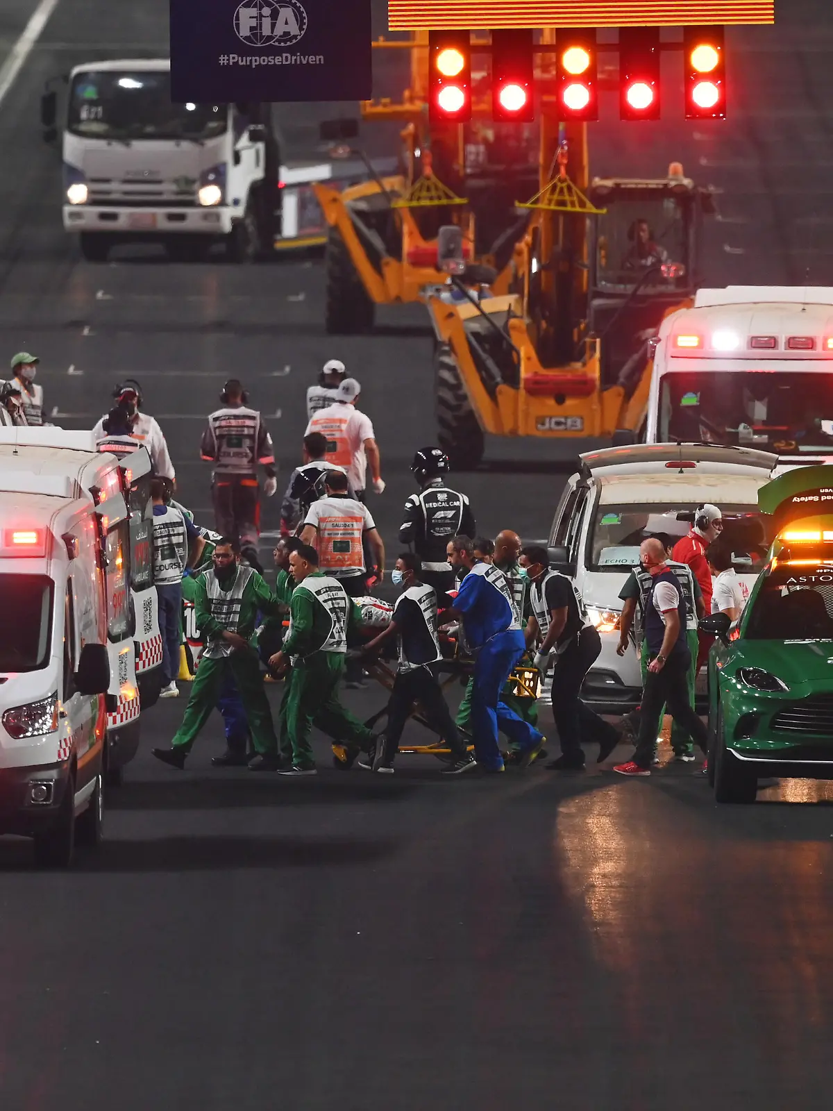JEDDAH, SAUDI ARABIA - DECEMBER 05: Theo Pourchaire of France and ART Grand Prix and Enzo Fittipaldi of Brazil and Charouz Racing System receive medical treatment after a crash at the start during the feature race of Round 7:Jeddah of the Formula 2 Championship at Jeddah Corniche Circuit on December 05, 2021 in Jeddah, Saudi Arabia. (Photo by Dan Mullan/Getty Images)