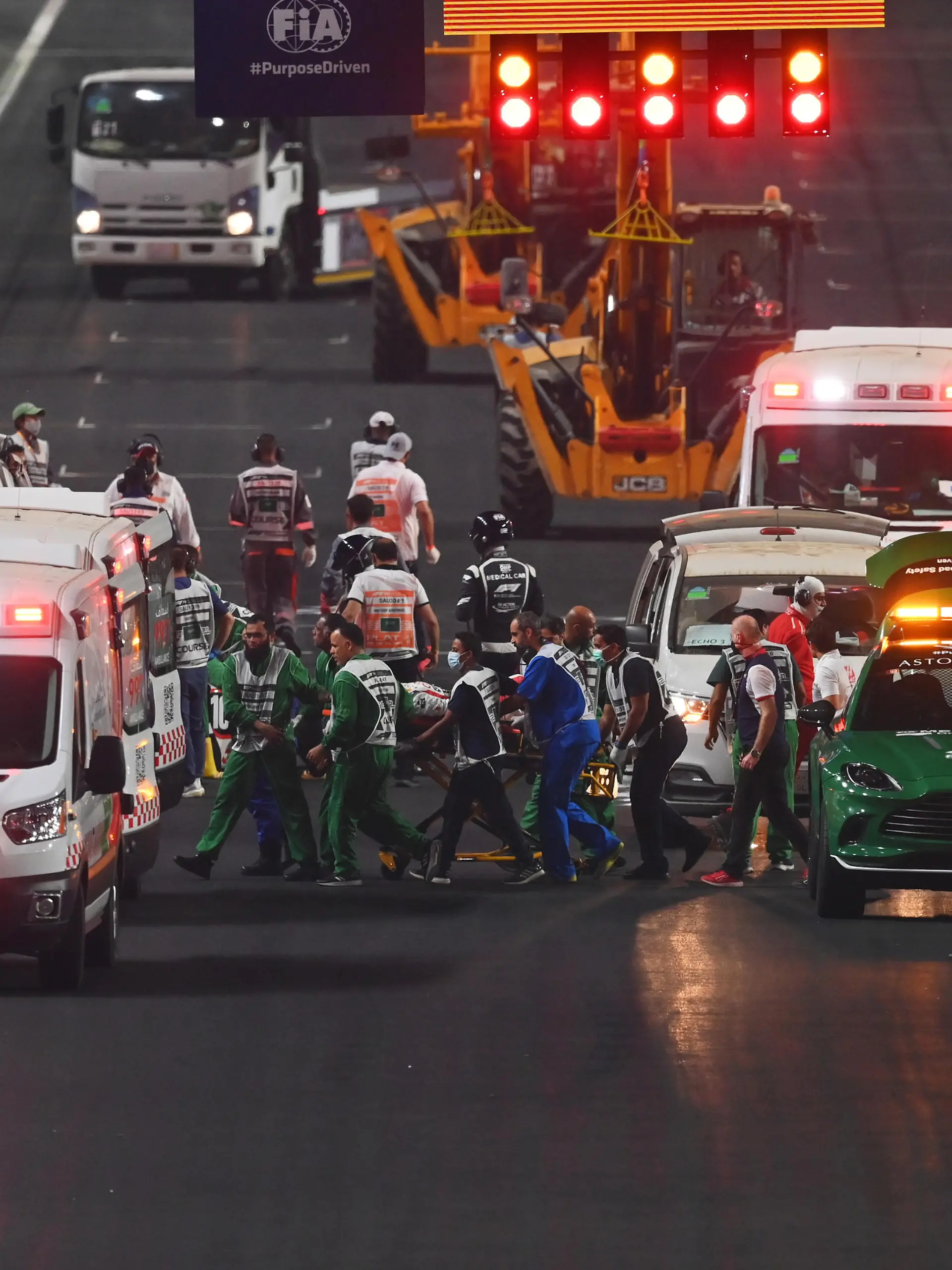 JEDDAH, SAUDI ARABIA - DECEMBER 05: Theo Pourchaire of France and ART Grand Prix and Enzo Fittipaldi of Brazil and Charouz Racing System receive medical treatment after a crash at the start during the feature race of Round 7:Jeddah of the Formula 2 Championship at Jeddah Corniche Circuit on December 05, 2021 in Jeddah, Saudi Arabia. (Photo by Dan Mullan/Getty Images)