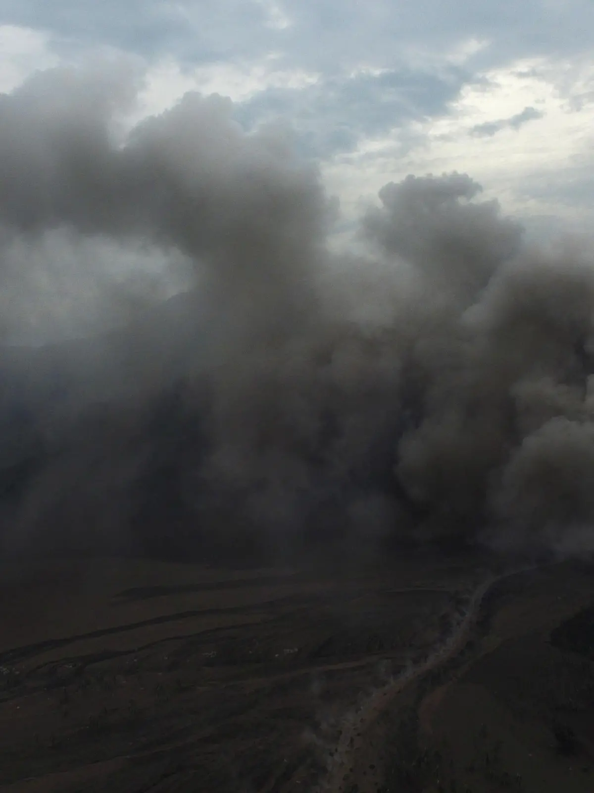 An aerial view shows volcanic ash rising affected by the Mount Semeru volcano during an eruption in Sumber Wuluh village, Lumajang, East Java province, Indonesia December 5, 2021, in this photo taken by Antara Foto/Zabur Karuru/via REUTERS.  ATTENTION EDITORS - THIS IMAGE WAS PROVIDED BY THIRD PARTY. MANDATORY CREDIT. INDONESIA OUT.