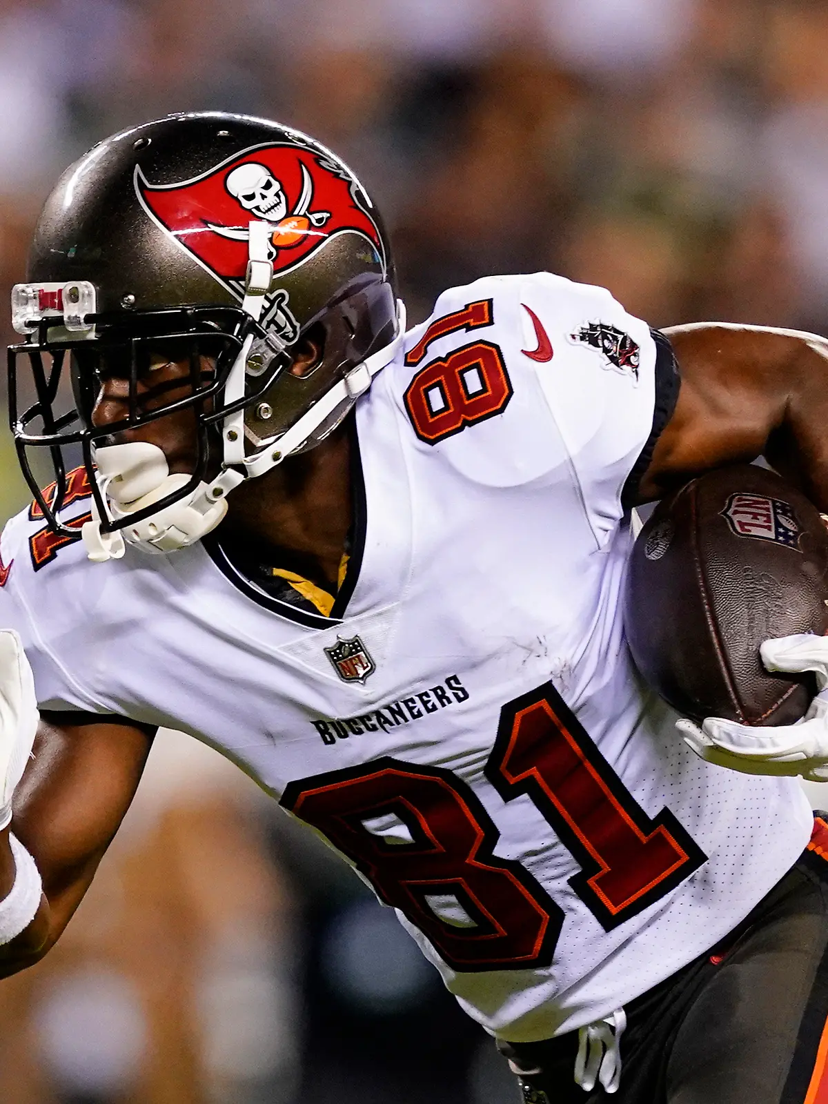 FILE - Tampa Bay Buccaneers wide receiver Antonio Brown runs with the ball during an NFL football game against the Philadelphia Eagles, Oct. 14, 2021, in Philadelphia. Brown and two other NFL players have been suspended immediately for three games by the league for violating COVID-19 protocols. Brown and teammate Mike Edwards were suspended Thursday, Dec. 2, 2021. Free agent John Franklin III, if signed by a team, is also ineligible to play in the next three games. (AP Photo/Matt Rourke, File)