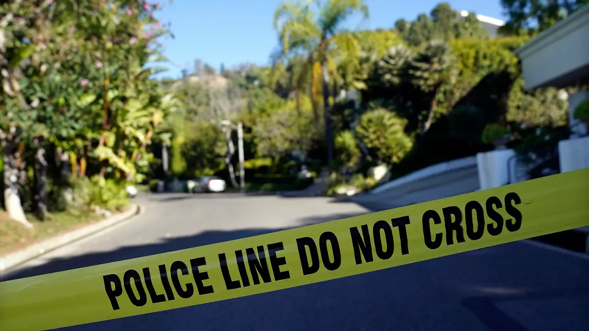Police tape blocks the intersection of Maytor Place and Barrie Drive in the Trousdale Estates section of Beverly Hills, Calif., Wednesday, Dec. 1, 2021. Jacqueline Avant, the wife of music legend Clarence Avant, was fatally shot in the neighborhood early Wednesday. (AP Photo/Chris Pizzello)