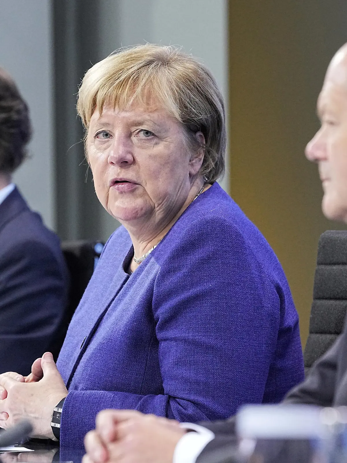 State Premier of North-Rhine Westphalia Hendrik Wuest, German Chancellor Angela Merkel and Germany's Social Democratic Party (SPD) candidate for chancellor Olaf Scholz attend a news conference in the Federal Chancellery following the video conference with the country's 16 state leaders on the surge in the coronavirus disease (COVID-19) cases, in Berlin, Germany, November 18, 2021. Michael Kappeler/Pool via REUTERS