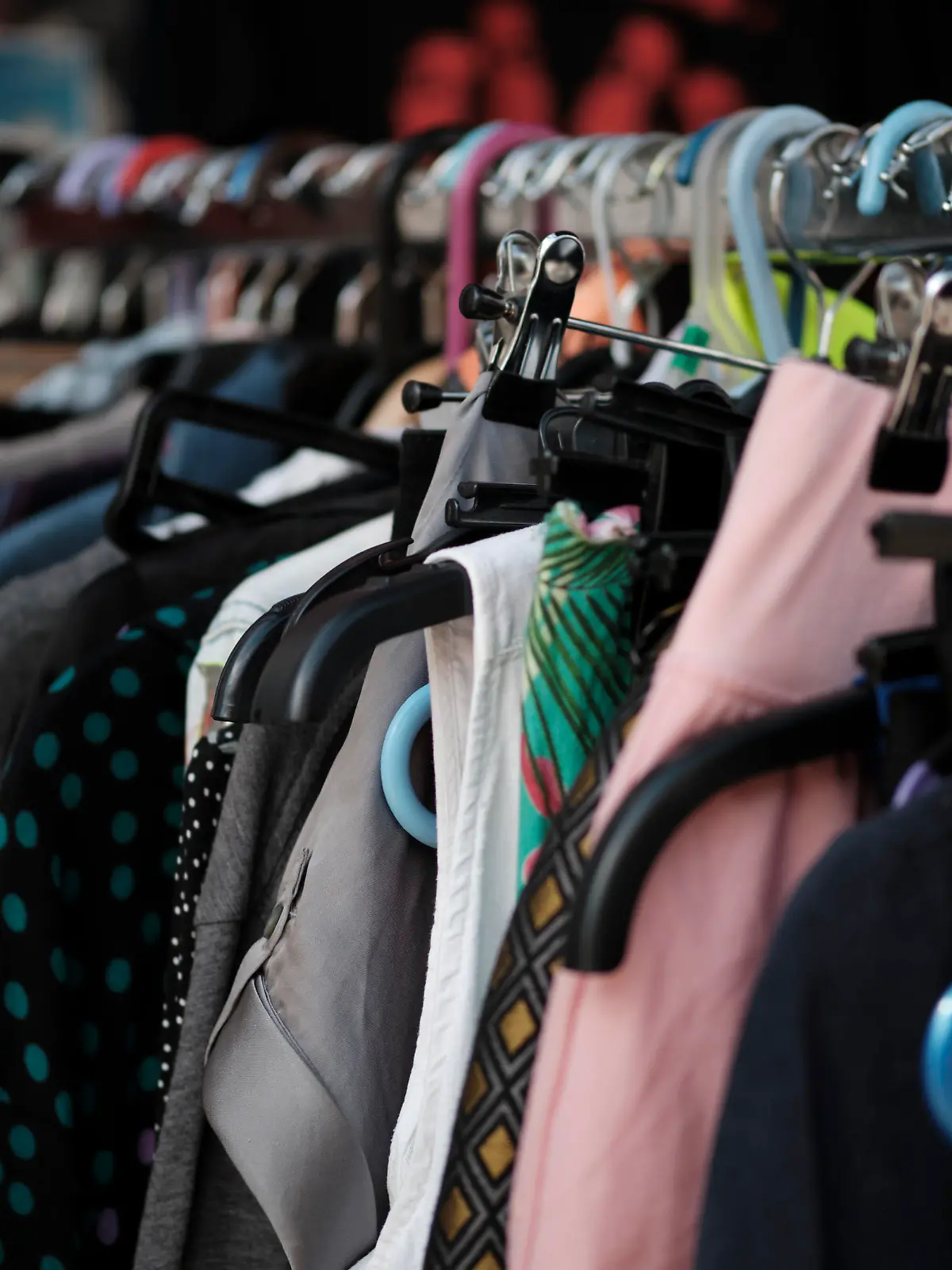 Vintage secondhand clothes hanging on a rack
