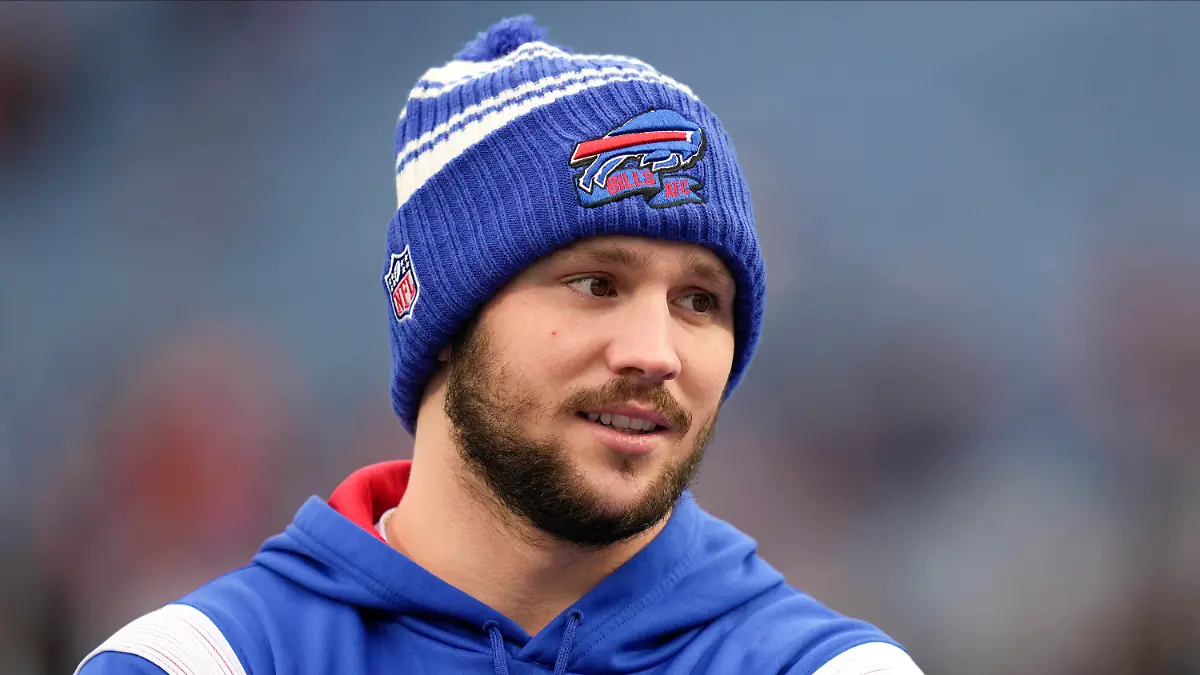 FILE - Buffalo Bills quarterback Josh Allen, left, talks with Cincinnati Bengals quarterback Joe Burrow before playing in an NFL division round football game, Sunday, Jan. 22, 2023, in Orchard Park, N.Y. For every example such as Kansas City's move to trade up for two-time MVP Patrick Mahomes in 2017 or Buffalo's decision the next year to move up for franchise quarterback Josh Allen, there are misses. (AP Photo/Seth Wenig,File)