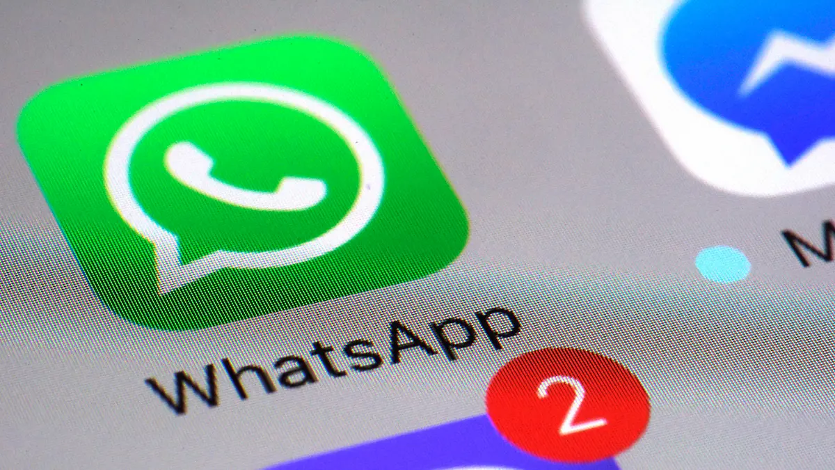 FILE - This Friday, March 10, 2017, file photo shows the WhatsApp communications app on a smartphone, in New York. In early January 2021, encrypted messaging apps Signal and Telegram are seeing huge upticks in downloads from Apple and Google's app stores, while WhatsApp's growth is on the decline following a privacy fiasco where the company was forced to clarify a message it sent to users. (AP Photo/Patrick Sison, File)
