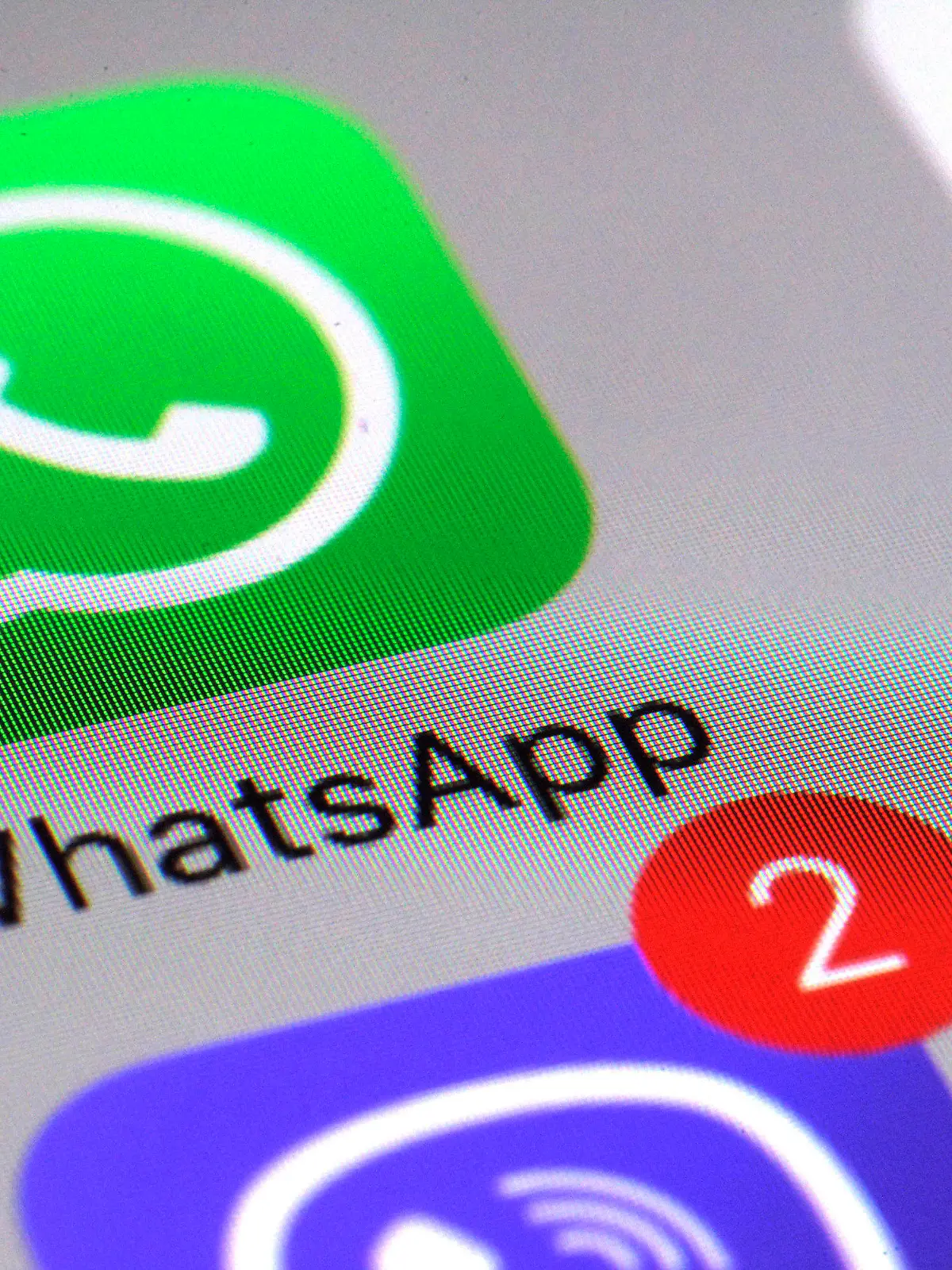 FILE - This Friday, March 10, 2017, file photo shows the WhatsApp communications app on a smartphone, in New York. In early January 2021, encrypted messaging apps Signal and Telegram are seeing huge upticks in downloads from Apple and Google's app stores, while WhatsApp's growth is on the decline following a privacy fiasco where the company was forced to clarify a message it sent to users. (AP Photo/Patrick Sison, File)