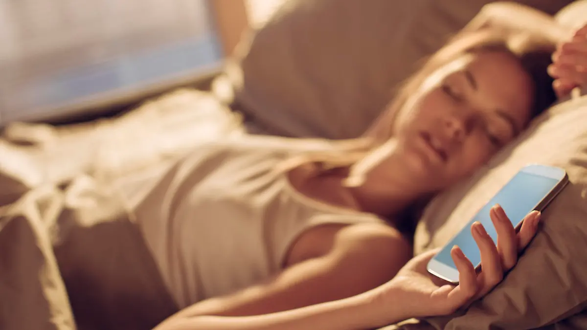 Close up of a young woman  fall asleep next to smart phone