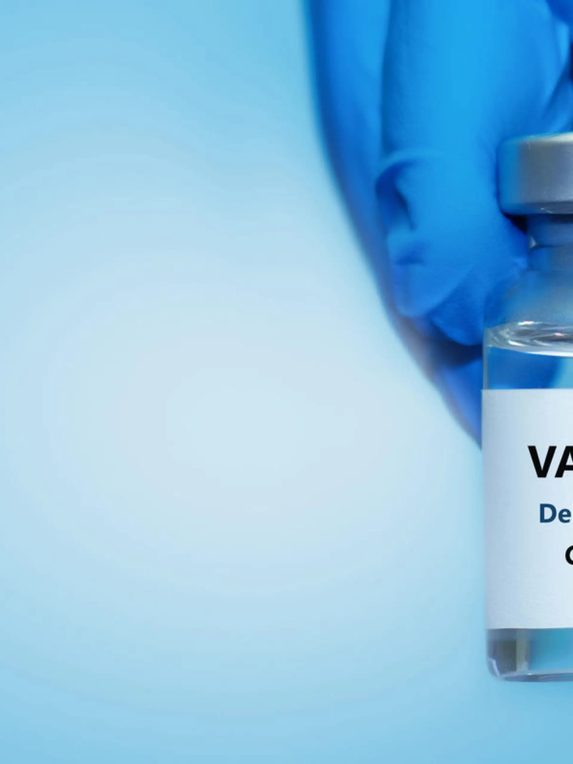 A doctor in medical gloves holds a bottle with coronavirus Covid19 Delta variant strain vaccine.The concept of medicine, healthcare and science.Coronavirus vaccine
