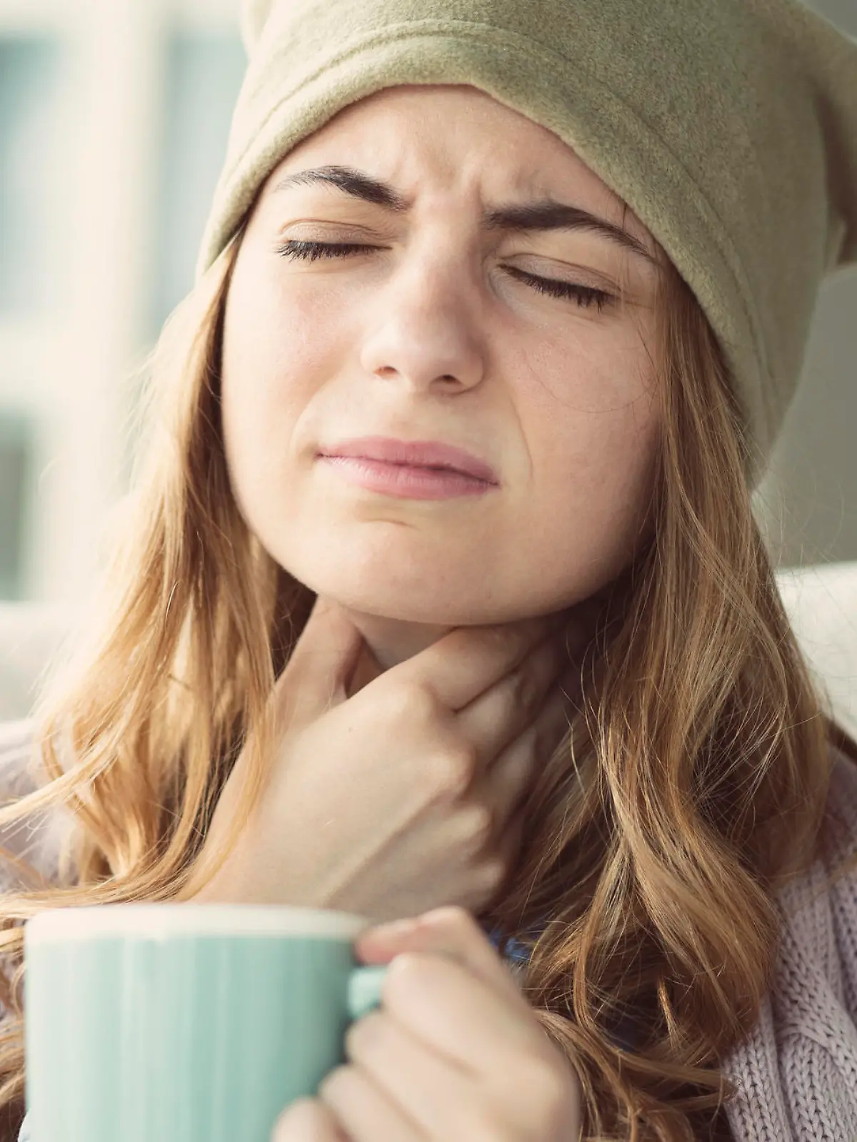 Young woman suffering from cold