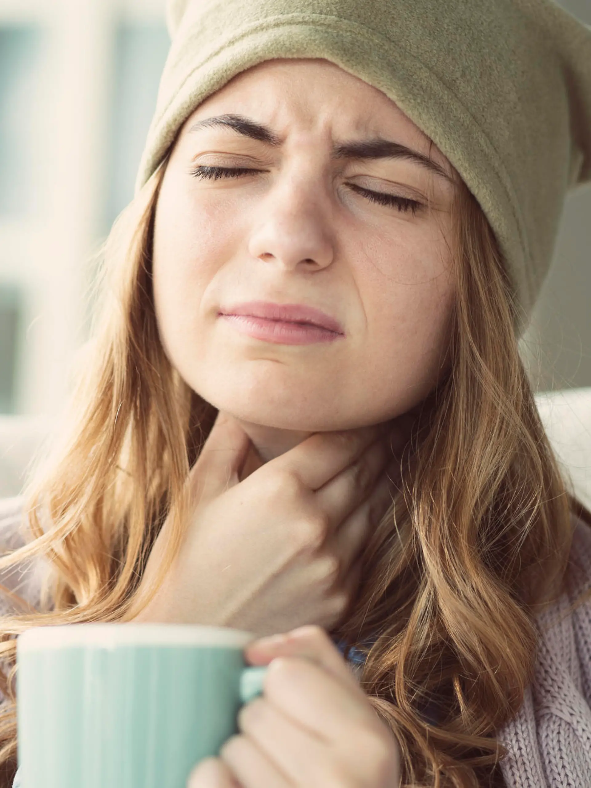Young woman suffering from cold