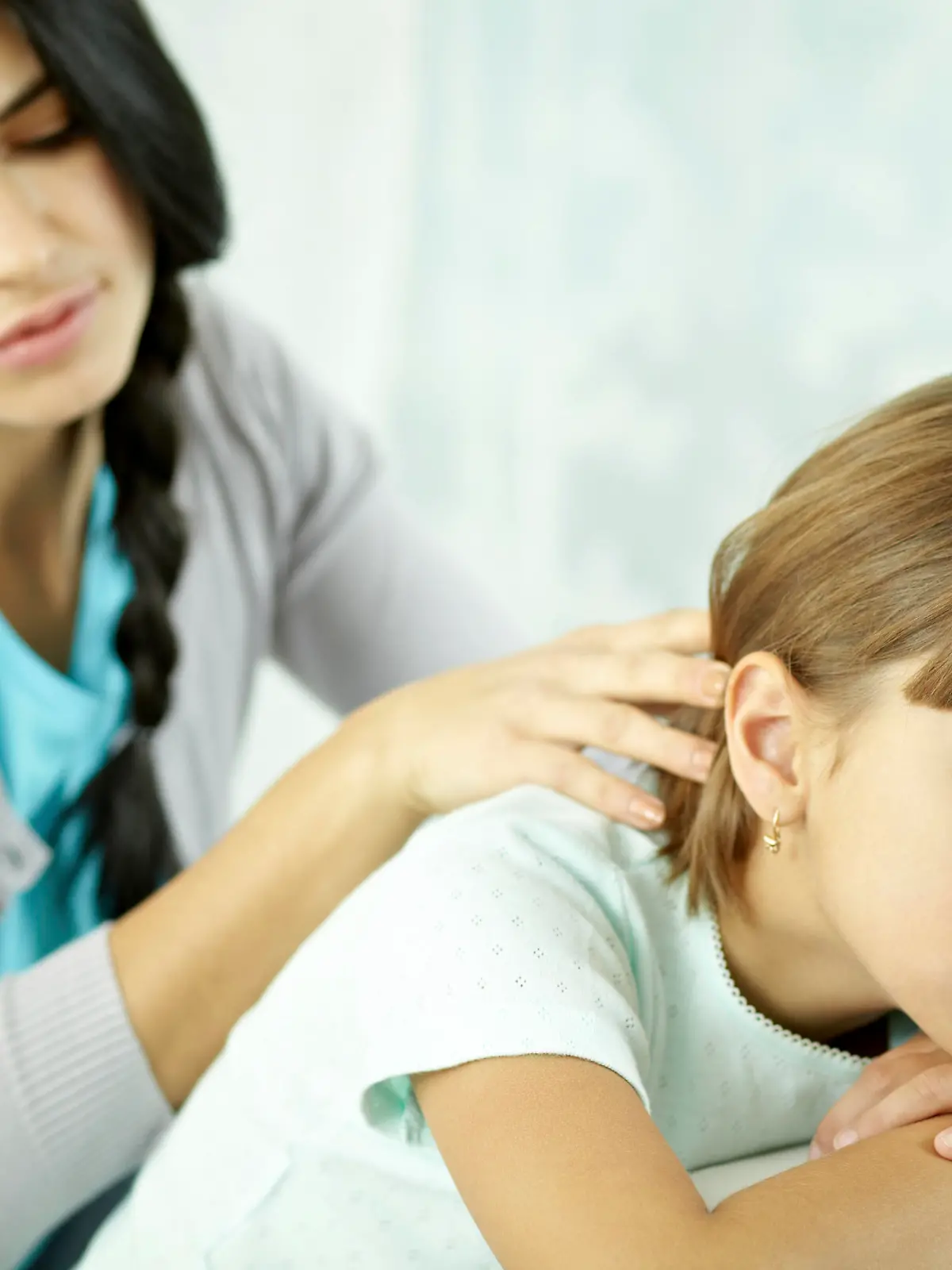 Woman consoling her upset child