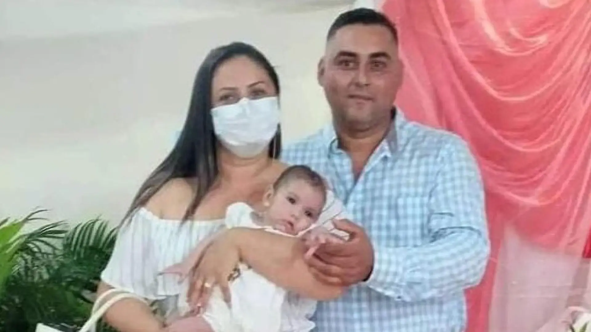 Maria Guadalupe Lopez Murillo, 9-months old baby who drowned in a pool n November 2021 in Manabi, Ecuador, pictured with her parents (left and right). (Newsflash)