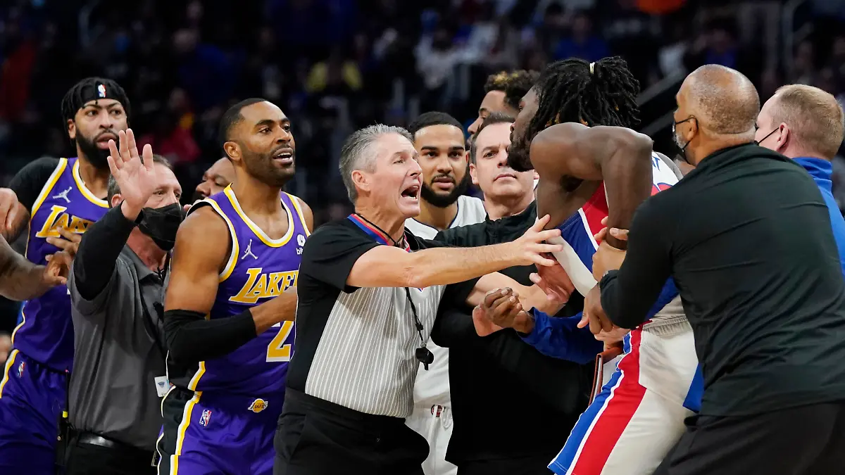 Players separate Detroit Pistons center Isaiah Stewart from Los Angeles Lakers forward LeBron James, not in frame, during the second half of an NBA basketball game, Sunday, Nov. 21, 2021, in Detroit. (AP Photo/Carlos Osorio)