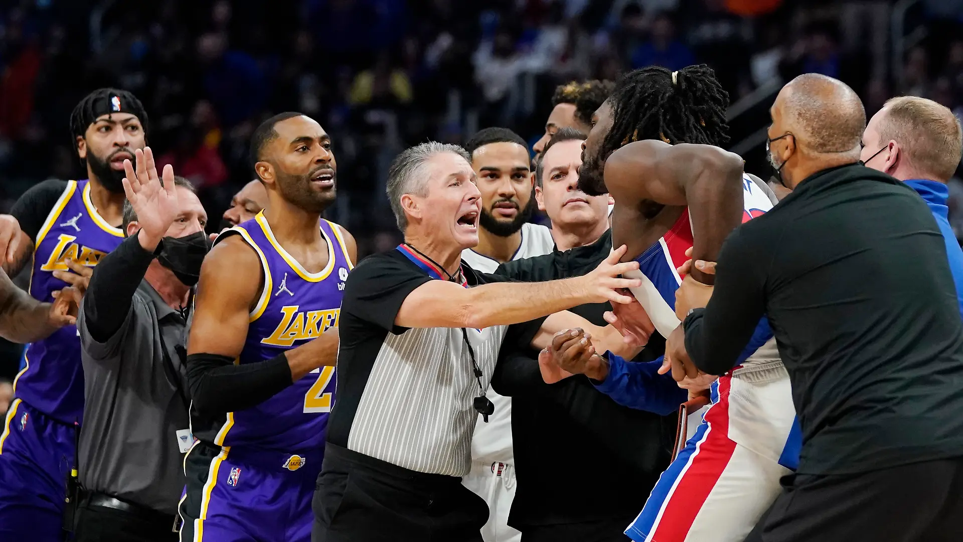 Players separate Detroit Pistons center Isaiah Stewart from Los Angeles Lakers forward LeBron James, not in frame, during the second half of an NBA basketball game, Sunday, Nov. 21, 2021, in Detroit. (AP Photo/Carlos Osorio)