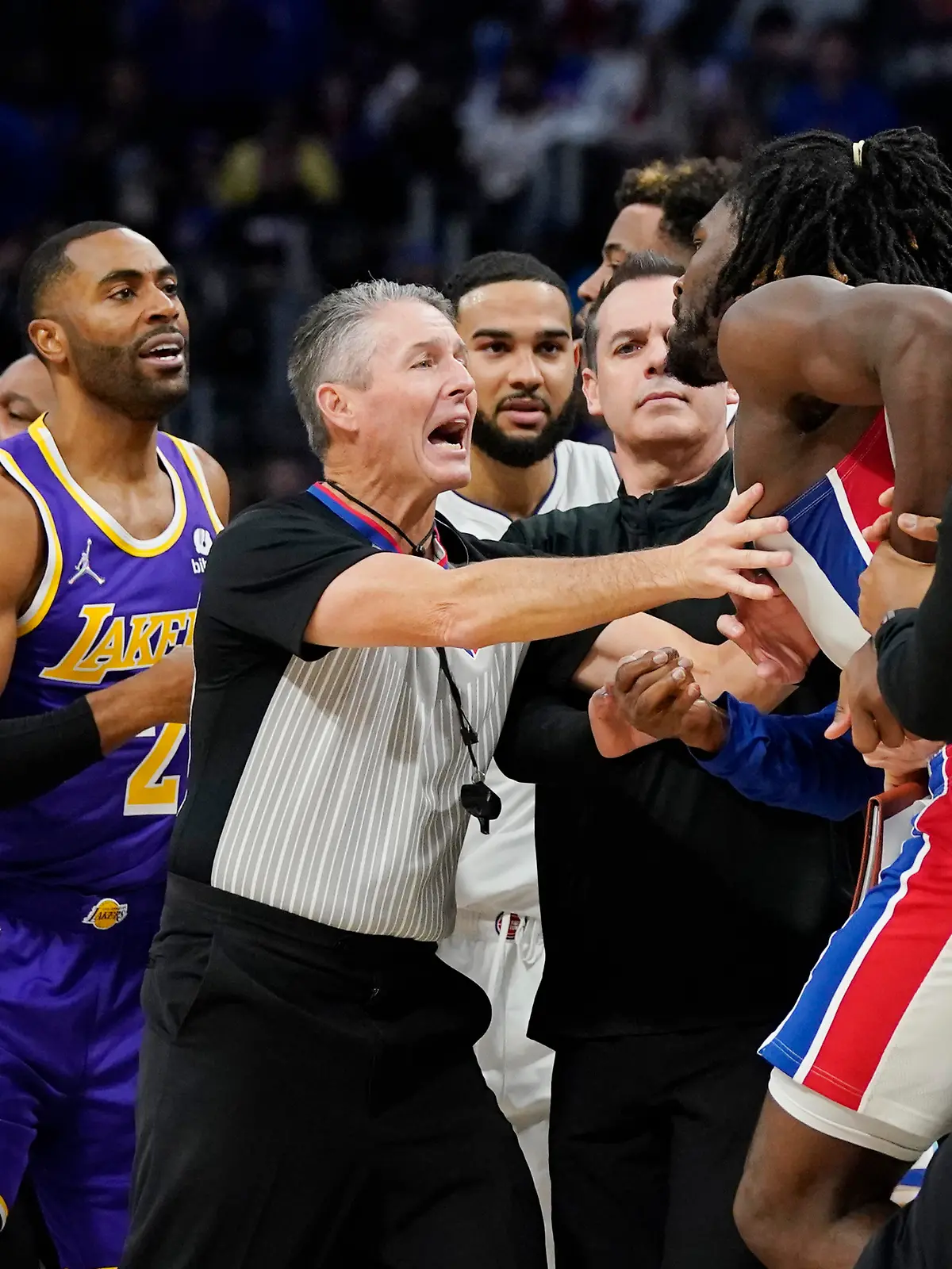 Players separate Detroit Pistons center Isaiah Stewart from Los Angeles Lakers forward LeBron James, not in frame, during the second half of an NBA basketball game, Sunday, Nov. 21, 2021, in Detroit. (AP Photo/Carlos Osorio)