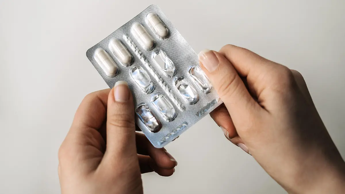 Female hands with blister pack. Close-up