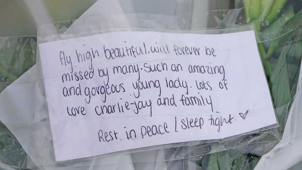 Bobbi-Anne McLeod missing. Flowers are left on Sheepstor Road in Plymouth, after the body of a woman was found in the hunt for missing Plymouth teenager Bobbi-Anne McLeod, who has not been seen since Saturday evening. Picture date: Wednesday November 24, 2021. Two men aged 24 and 26 have been arrested after the body of a woman was located during searches for the missing 18-year-old. See PA story POLICE McLeod. Photo credit should read: Ben Birchall/PA Wire URN:63926535