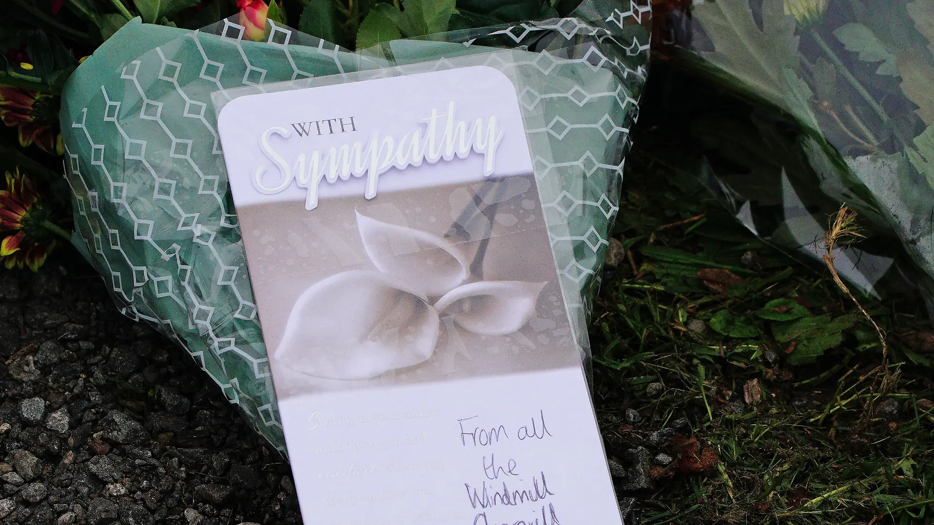 Bobbi-Anne McLeod missing. Flowers are left on Sheepstor Road in Plymouth, after the body of a woman was in the hunt for missing Plymouth teenager Bobbi-Anne McLeod, who has not been seen since Saturday evening. Picture date: Wednesday November 24, 2021. Two men aged 24 and 26 have been arrested after the body of a woman was located during searches for the missing 18-year-old. See PA story POLICE McLeod. Photo credit should read: Ben Birchall/PA Wire URN:63925263