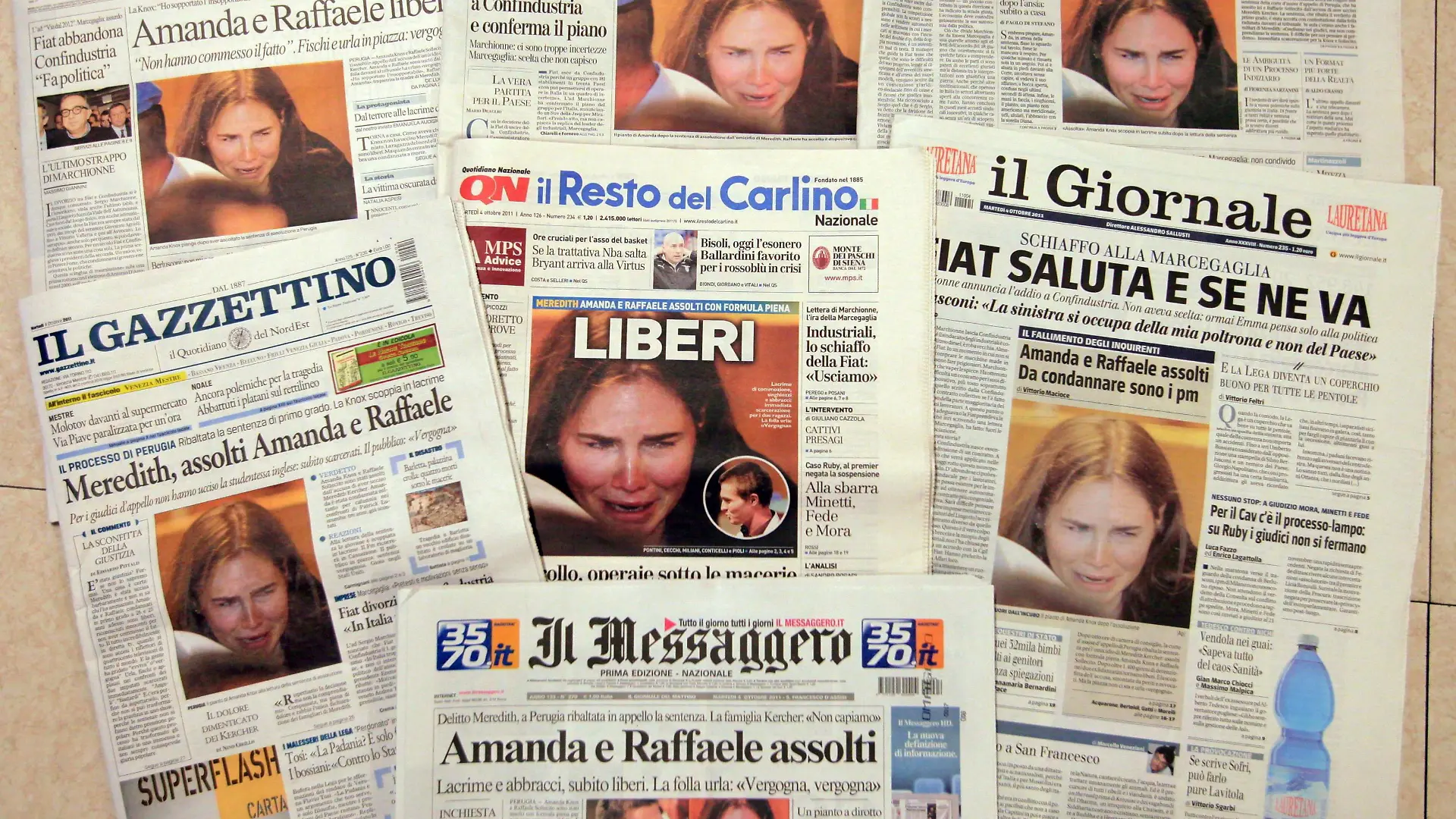 epa02950514 Italian newspaper front pages on 04 October 2011, in Rome, Italy, leading with the story of Amanda Knox after she was acquitted of murder and sexual assault by an Italian appeal court after spending four years in custody over the killing of her British housemate Meredith Kercher on 03 October 2011. EPA/LUCIANO DEL CASTILLO ++